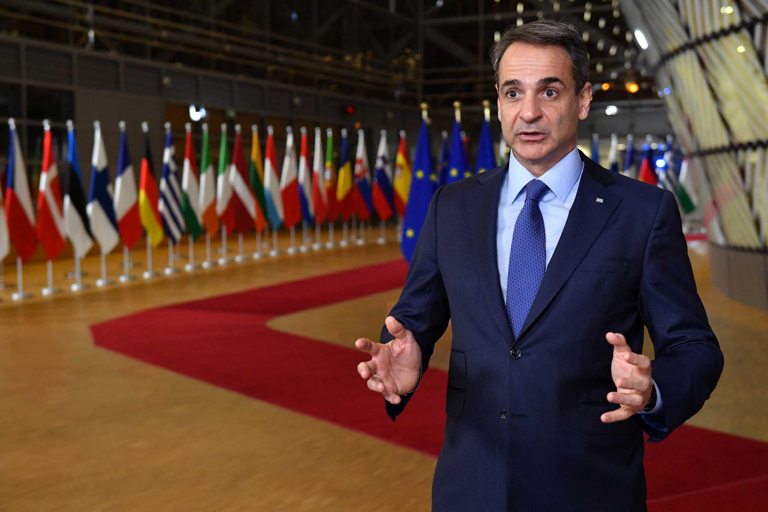 Greece's Prime Minister Kyriakos Mitsotakis speaks to press as he arrives for an emergency European Union (EU) summit at The European Council Building, on the situation in Ukraine after Russia launched an invasion in Brussels, Belgium February 24, 2022. John Thys