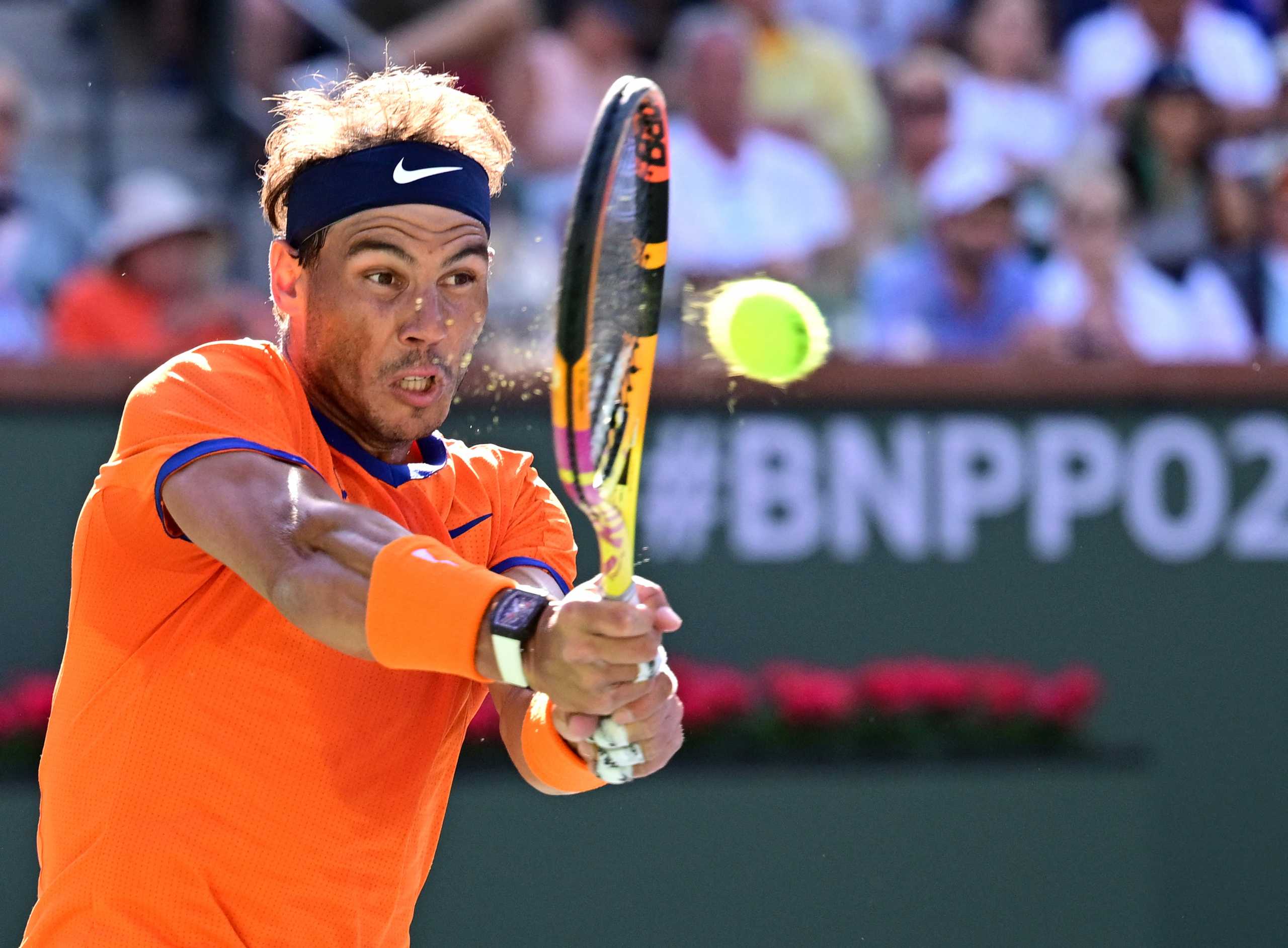 Mar 20, 2022; Indian Wells, CA, USA;  Rafael Nadal (ESP) hits a shot during the men’s final against Taylor Fritz (USA) at the BNP Paribas Open at the Indian Wells Tennis Garden. Mandatory Credit: Jayne Kamin-Oncea-USA TODAY Sports