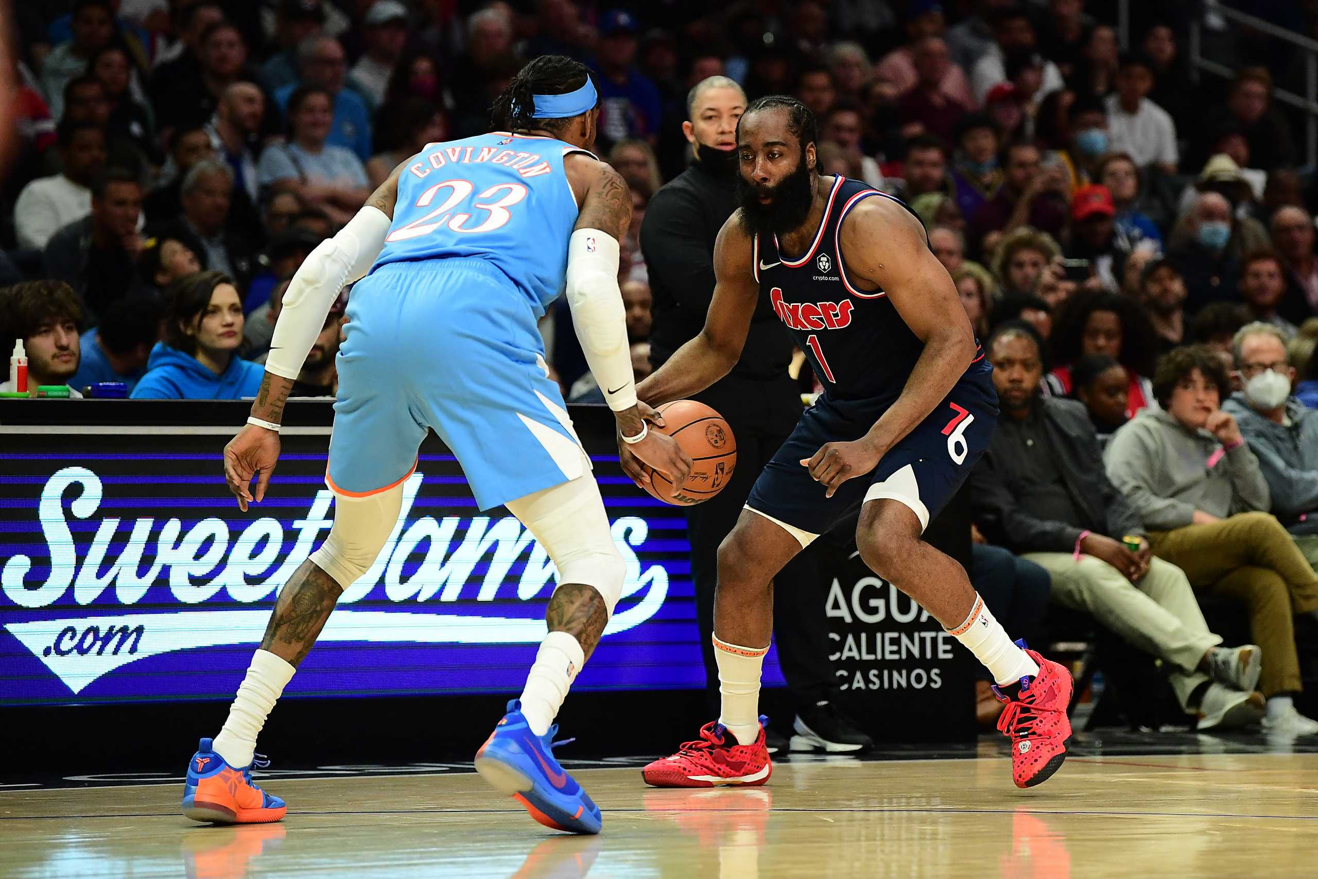Mar 25, 2022; Los Angeles, California, USA; Philadelphia 76ers guard James Harden (1) controls the ball against Los Angeles Clippers forward Robert Covington (23) during the second half at Crypto.com Arena. Mandatory Credit: Gary A. Vasquez-USA TODAY Sports