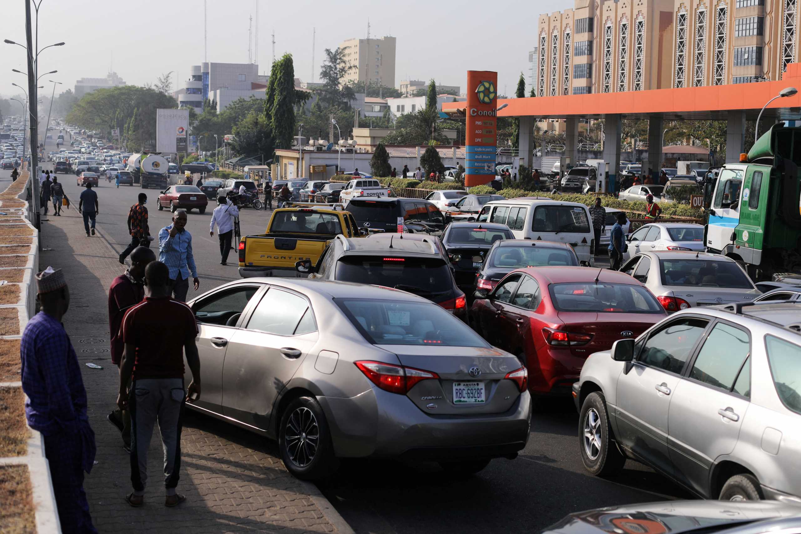 Cars queue due to shortage of petrol following importation of toxic petrol in Abuja, Nigeria, February 16, 2022. REUTERS