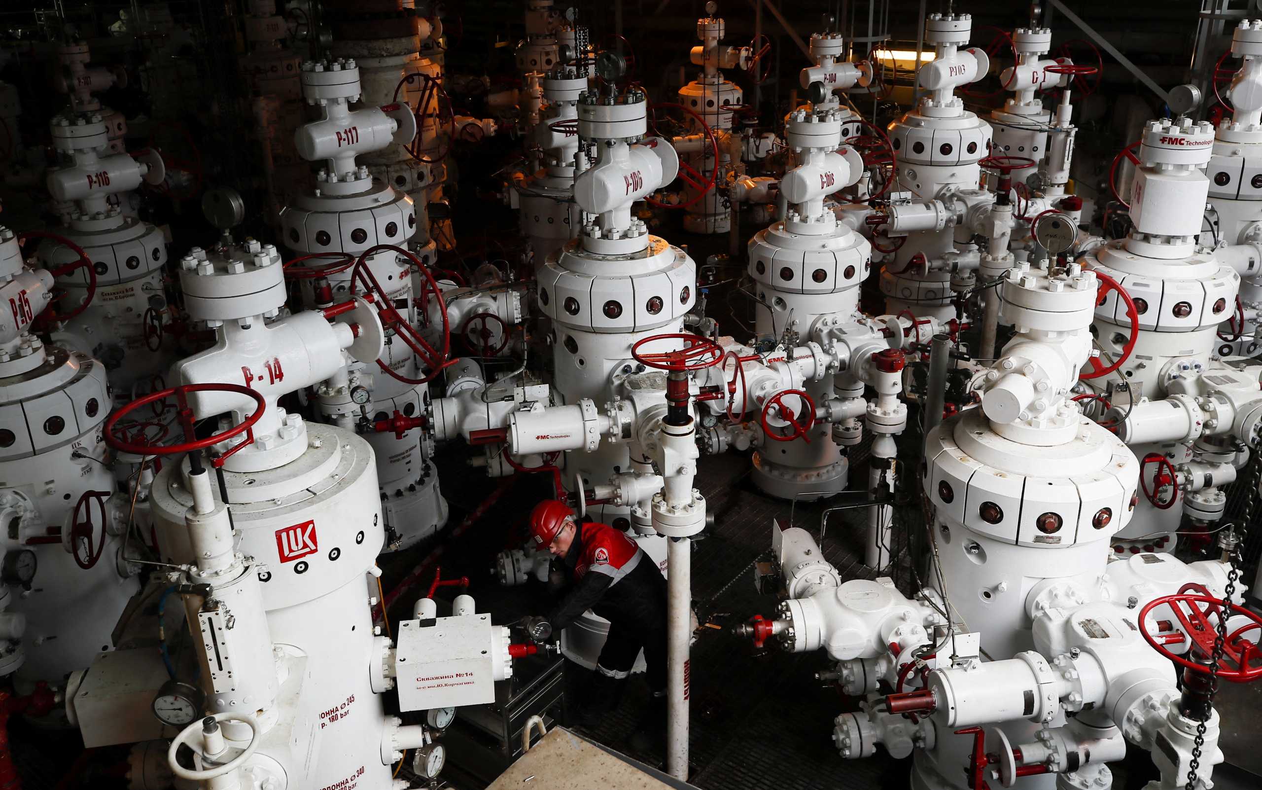 FILE PHOTO: A specialist inspects valves at the Korchagina oil platform operated by Lukoil company in Caspian Sea, Russia October 17, 2018. REUTERS