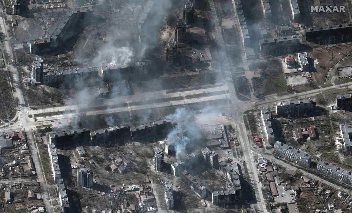 A satellite image shows buildings on fire, in Mariupol, Ukraine, March 22, 2022. Satellite image ©2022 Maxar Technologies