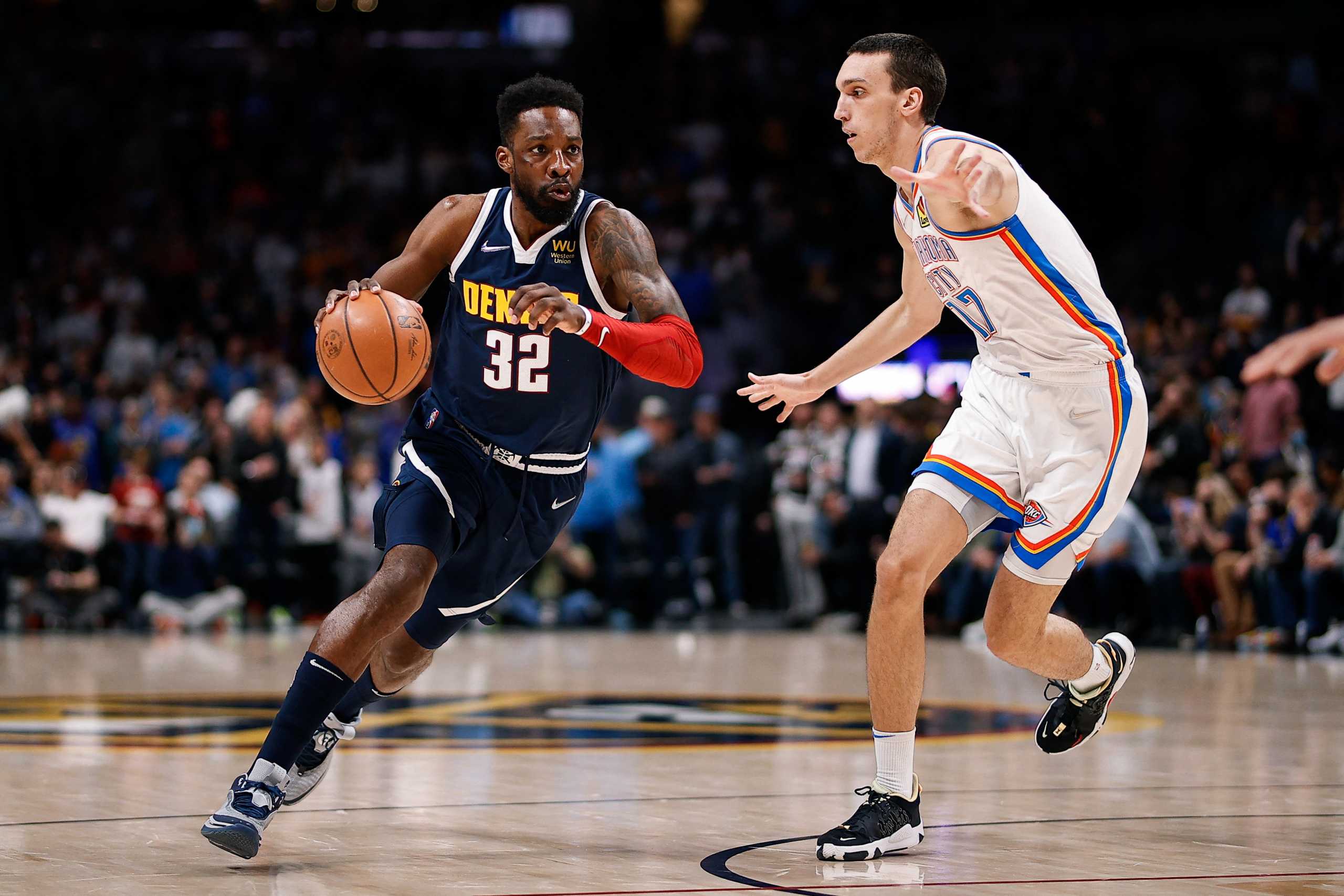Mar 2, 2022; Denver, Colorado, USA; Denver Nuggets forward Jeff Green (32) drives to the net against Oklahoma City Thunder center Aleksej Pokusevski (17) in the first quarter at Ball Arena. Mandatory Credit: Isaiah J. Downing-USA TODAY Sports
