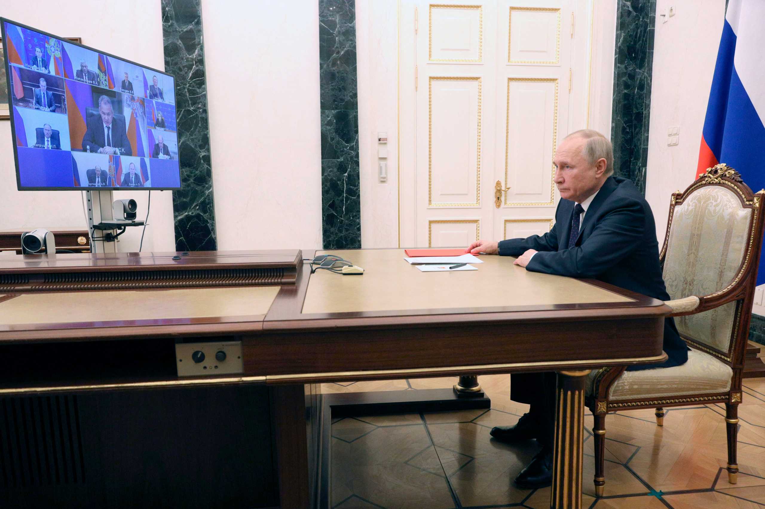 Russian President Vladimir Putin chairs a meeting with members of the Security Council via a video link at the Kremlin in Moscow, Russia March 11, 2022. Sputnik
