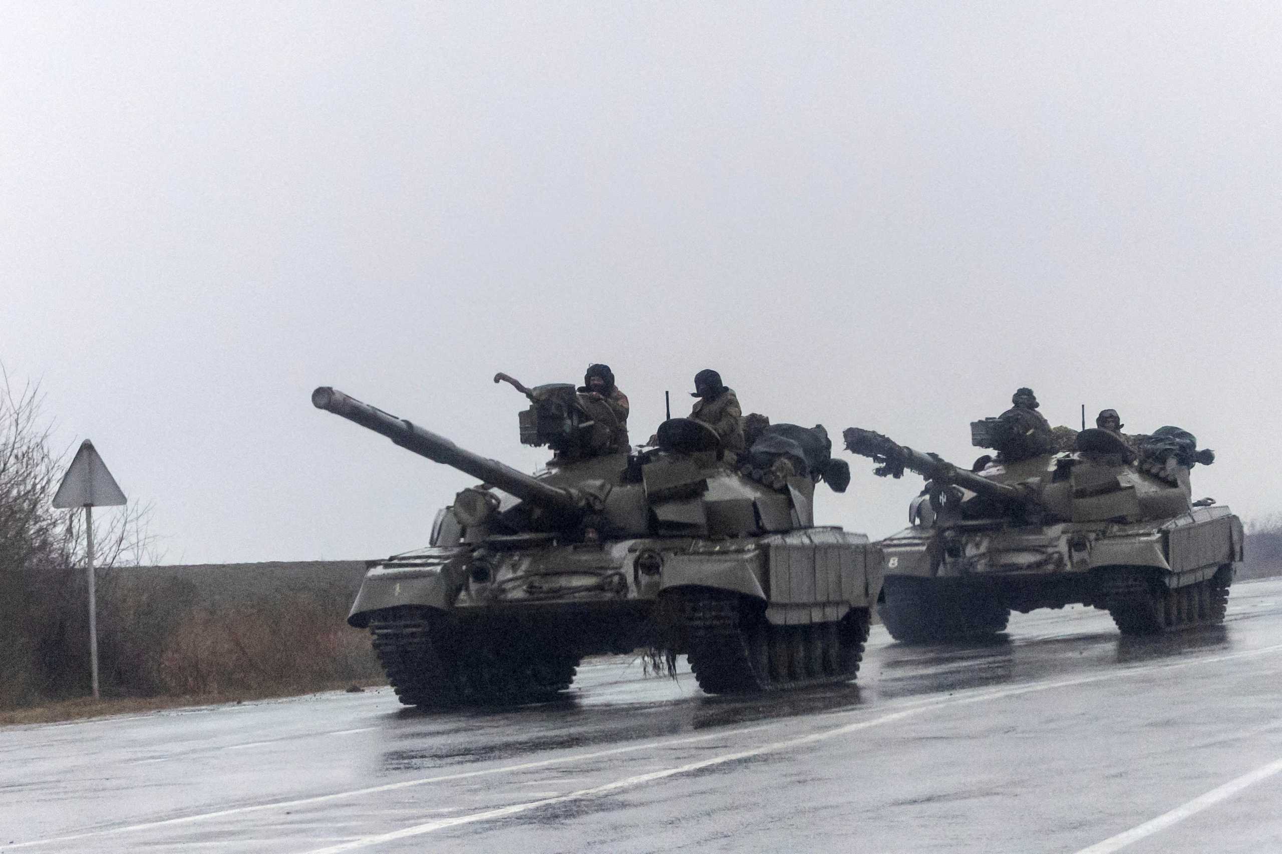 Ukrainian tanks move into the city, after Russian President Vladimir Putin authorized a military operation in eastern Ukraine, in Mariupol, February 24, 2022. REUTERS