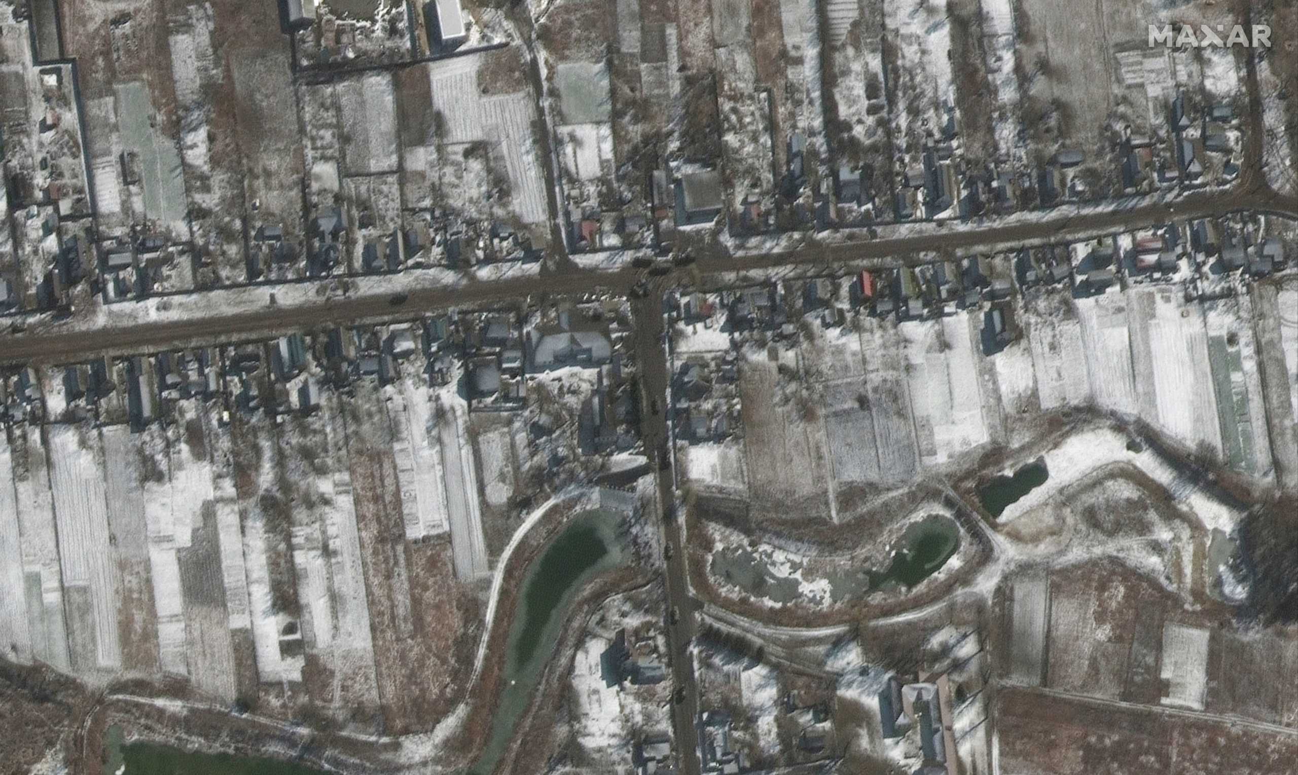 A satellite image shows troops and equipment deployed, amid Russia's ongoing invasion of Ukraine, in Ozera, northeast of Antonov Airport, Ukraine, March 10, 2022. Satellite image ©2022 Maxar Technologies