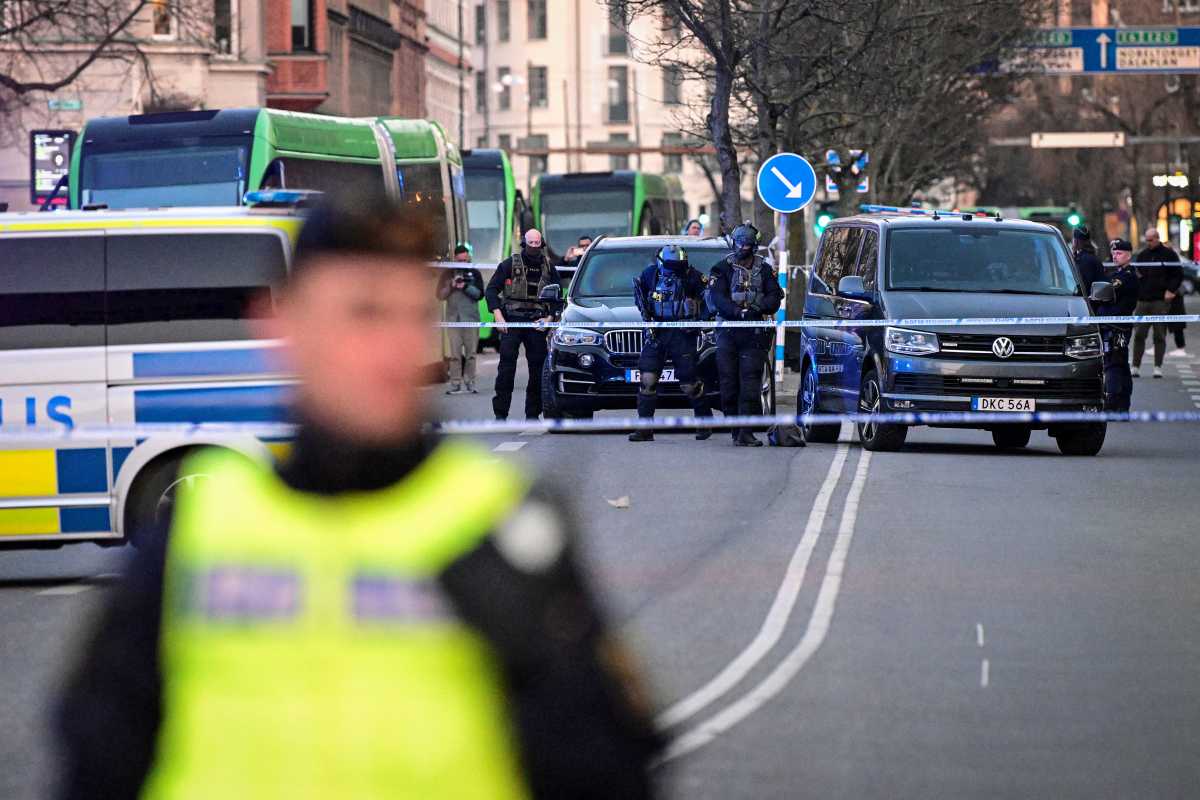 Police officers gather at the scene of a crime by a school in Malmo, Sweden March 21, 2022. TT News Agency