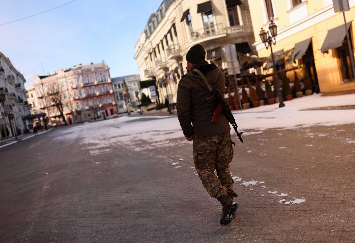 A Ukrainian military officer walks on a street, as Russia's invasion of Ukraine continues, in downtown Odessa, Ukraine, March 12, 2022. REUTERS