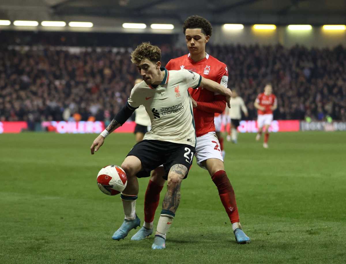 Soccer Football - FA Cup Quarter Final - Nottingham Forest v Liverpool - The City Ground, Nottingham, Britain - March 20, 2022 Liverpool's Kostas Tsimikas in action with Nottingham Forest's Brennan Johnson Action Images via Reuters