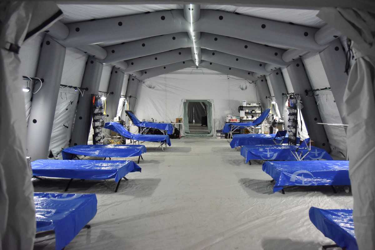 Empty beds are seen at a field hospital deployed by American doctors from the "Samaritan's Purse" organization in an underground parking lot of the King Cross Leopolis shopping mall, amid Russia's invasion of Ukraine, at the village of Sokilnyky, near Lviv, Ukraine, March 14, 2022. REUTERS
