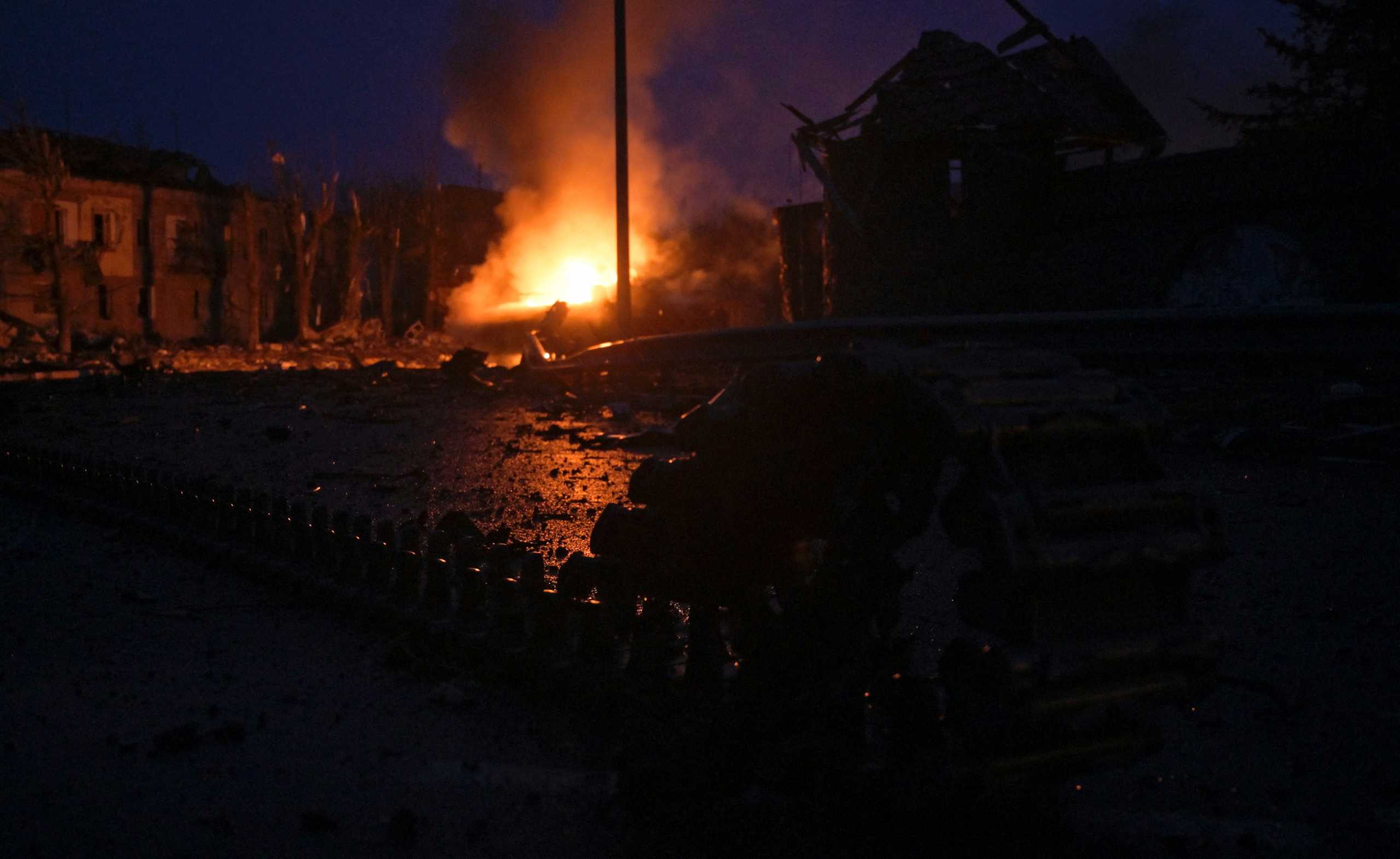 An armoured vehicle burns at the residential area following recent shelling, as Russia's invasion of Ukraine continues, in the settlement of Borodyanka in the Kyiv region, Ukraine March 2, 2022. REUTERS