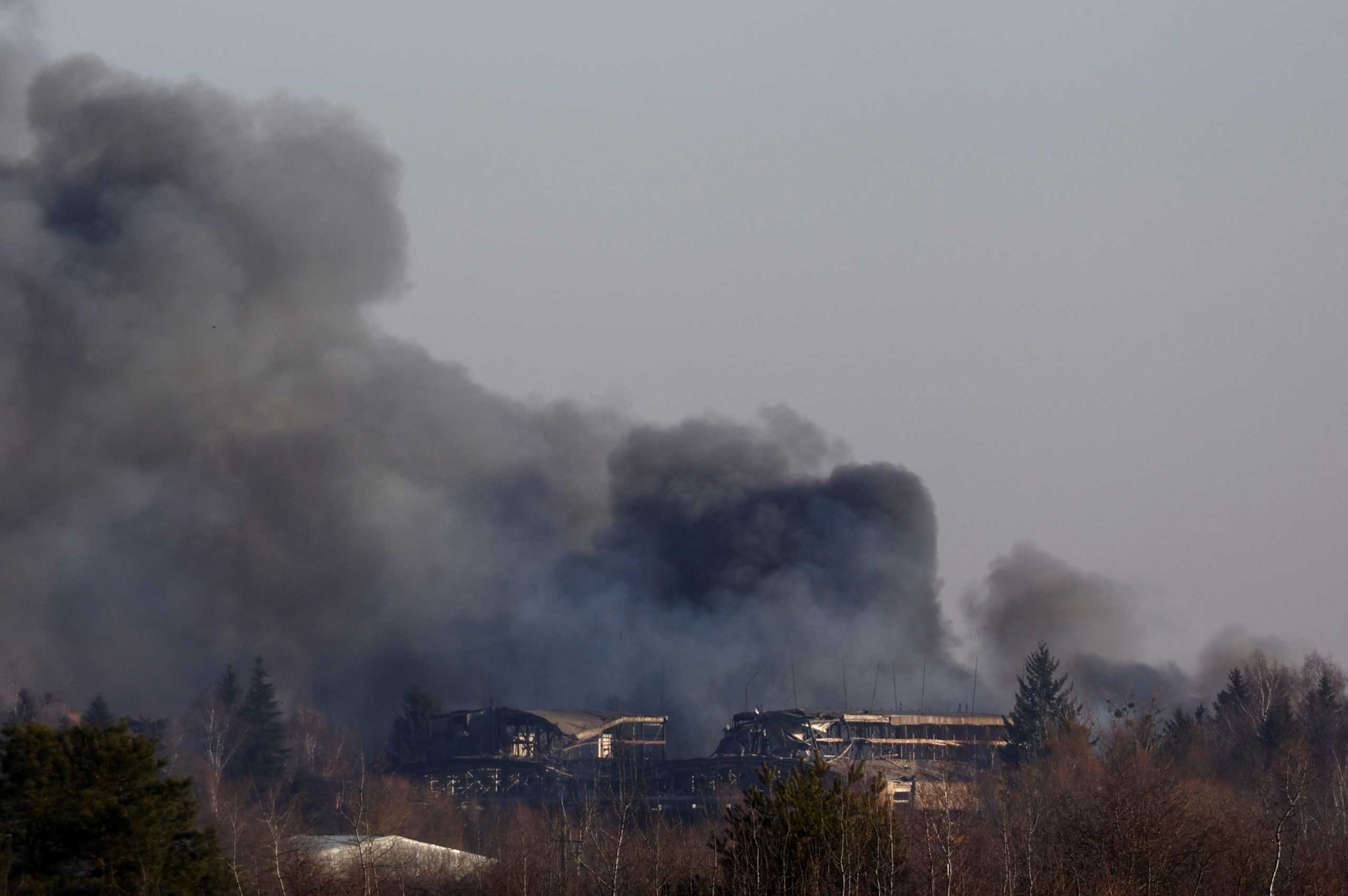 Smoke rises from a factory building near Lviv airport, as Russia's invasion of Ukraine continues, in Lviv, Ukraine, March 18, 2022. REUTERS