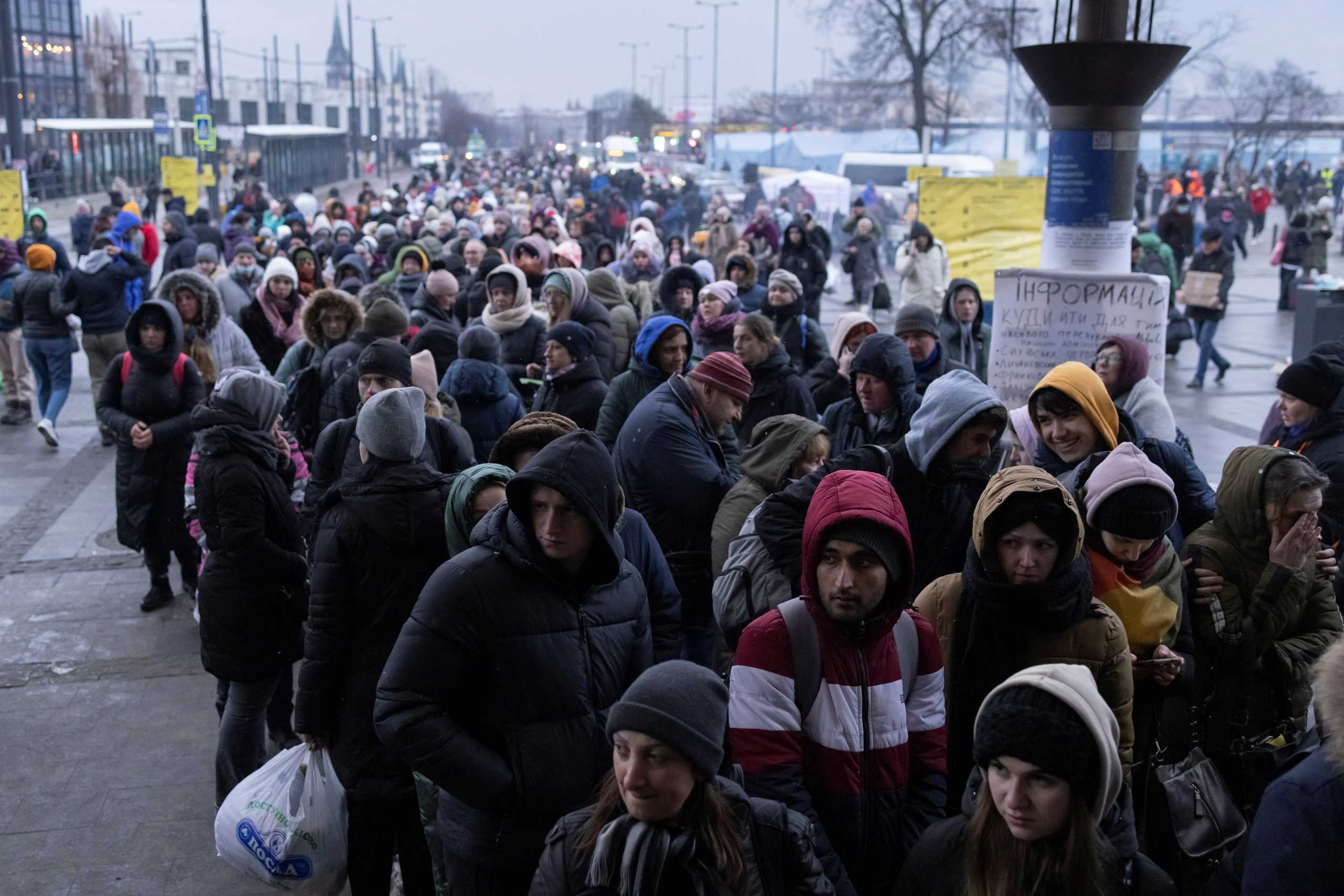 Refugees queue for trains to Poland following the Russian invasion of Ukraine, at the train station in Lviv, Ukraine, March 7, 2022. REUTERS