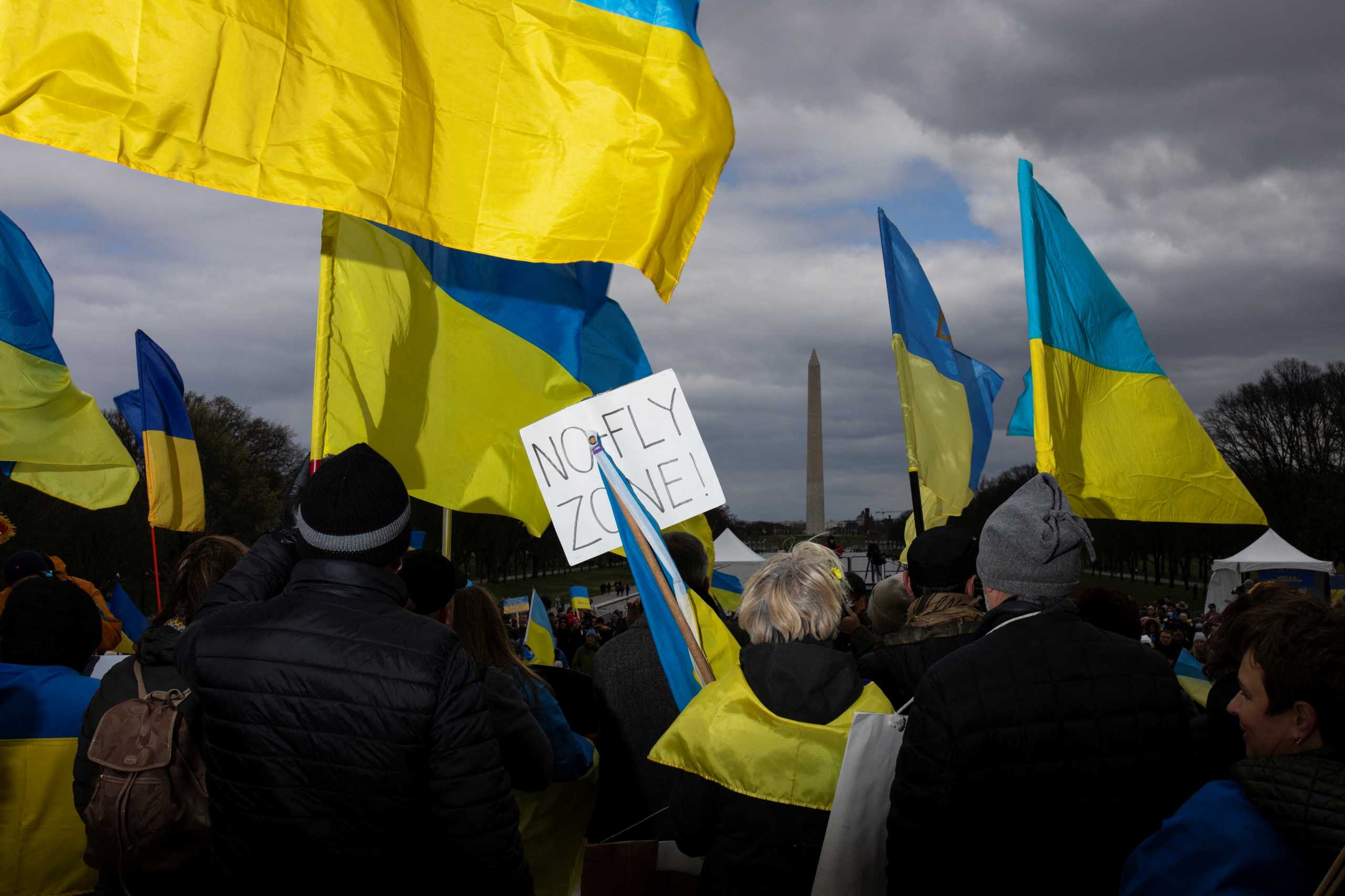 Demonstrators display flags and signs calling for the closure of Ukrainian airspace during a “Stand with Ukraine” rally at the Lincoln Memorial on the National Mall in Washington, U.S., March 27, 2022. REUTERS