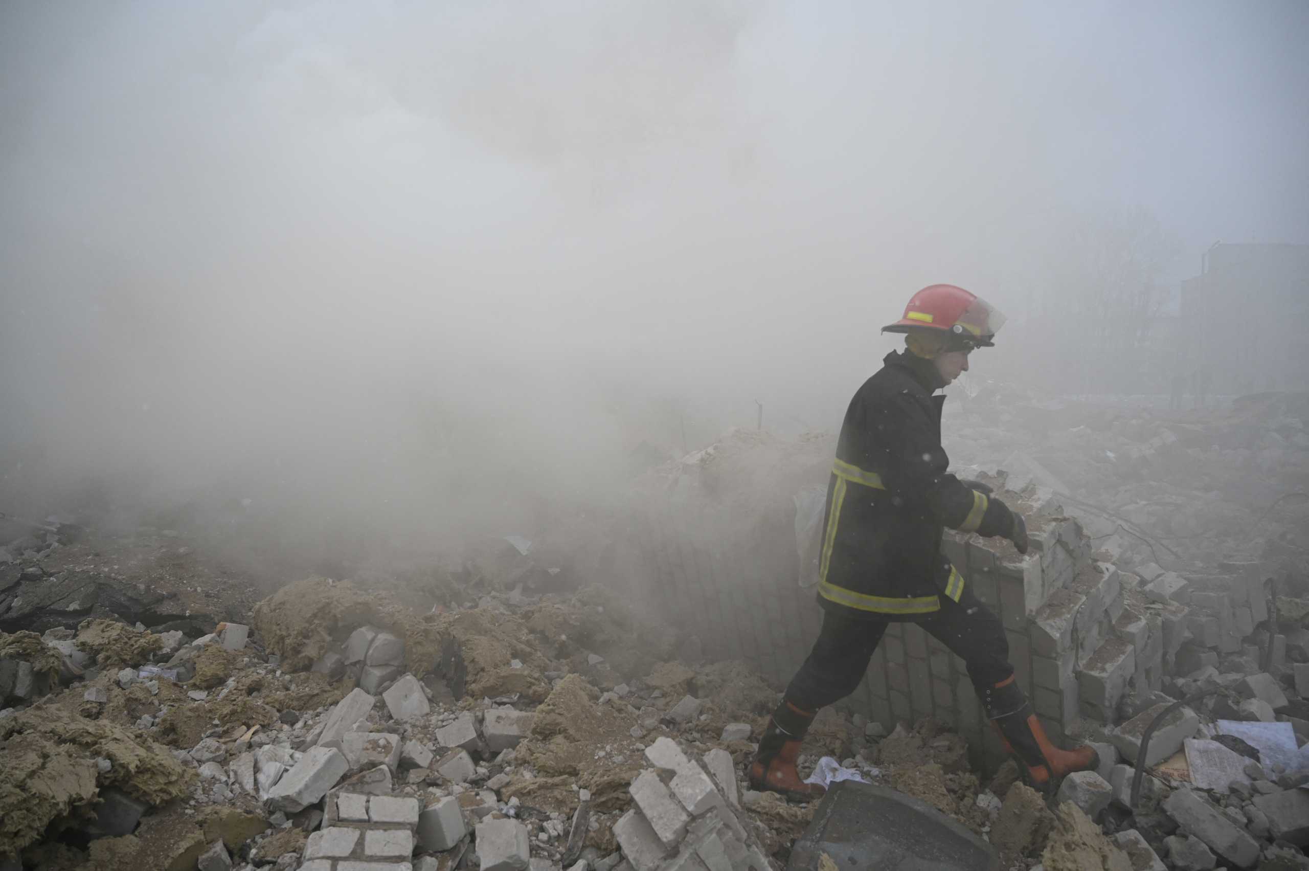 A firefighter walks amidst the debris of a school building destroyed by shelling, as Russia's invasion of Ukraine continues, in Zhytomyr, Ukraine March 4, 2022. REUTERS