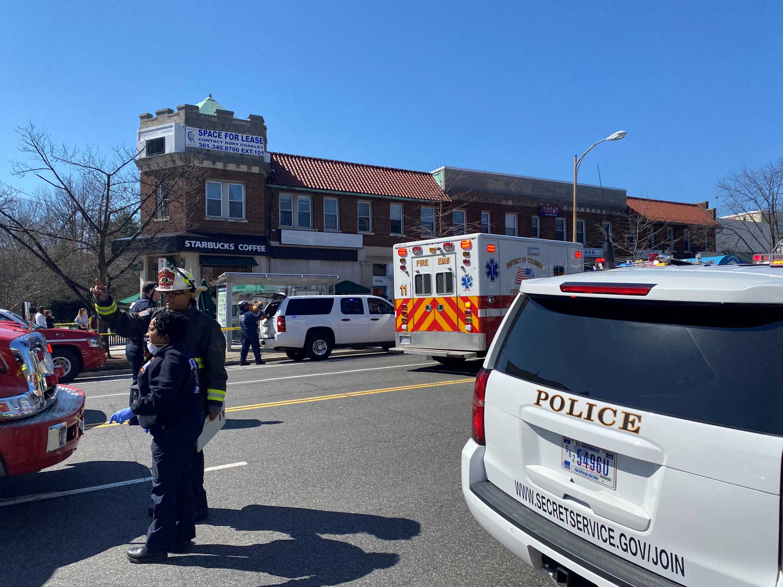 Members of the emergency services work at the site where an SUV crashed into the outdoor seating area of Parthenon Restaurant in Washington, U.S., March 11, 2022 in this image obtained from social media. @T_Jones_Media