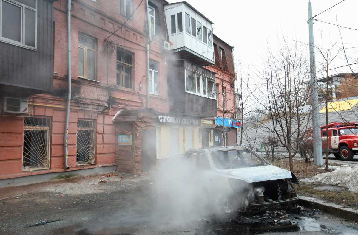 A view shows a burnt car in a street in Kharkiv, Ukraine, March 1, 2022. REUTERS