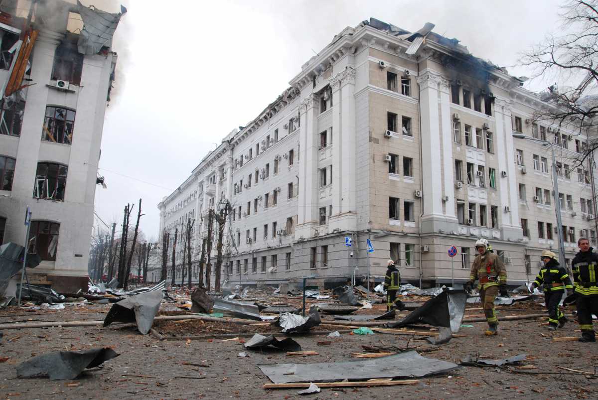 Firefighters work near the buildings of Kharkiv National University and a regional police department, which city officials said were damaged by recent shelling, in Kharkiv, Ukraine March 2, 2022. REUTERS