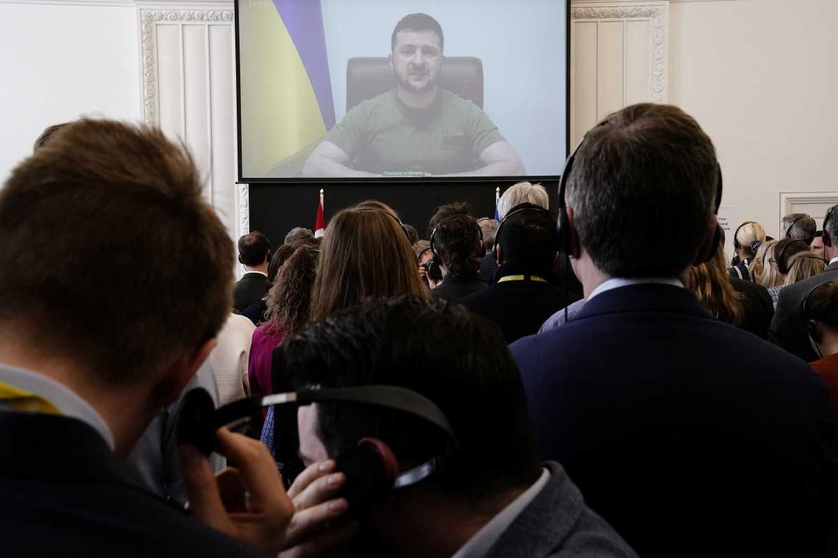 Members of the Danish Parliament attend the Ukrainian President Volodymyr Zelenskiy's speech to the Danish Parliament via video link, at the Christiansborg Castle in Copenhagen, Denmark, March 29, 2022. Mads Claus Rasmussen