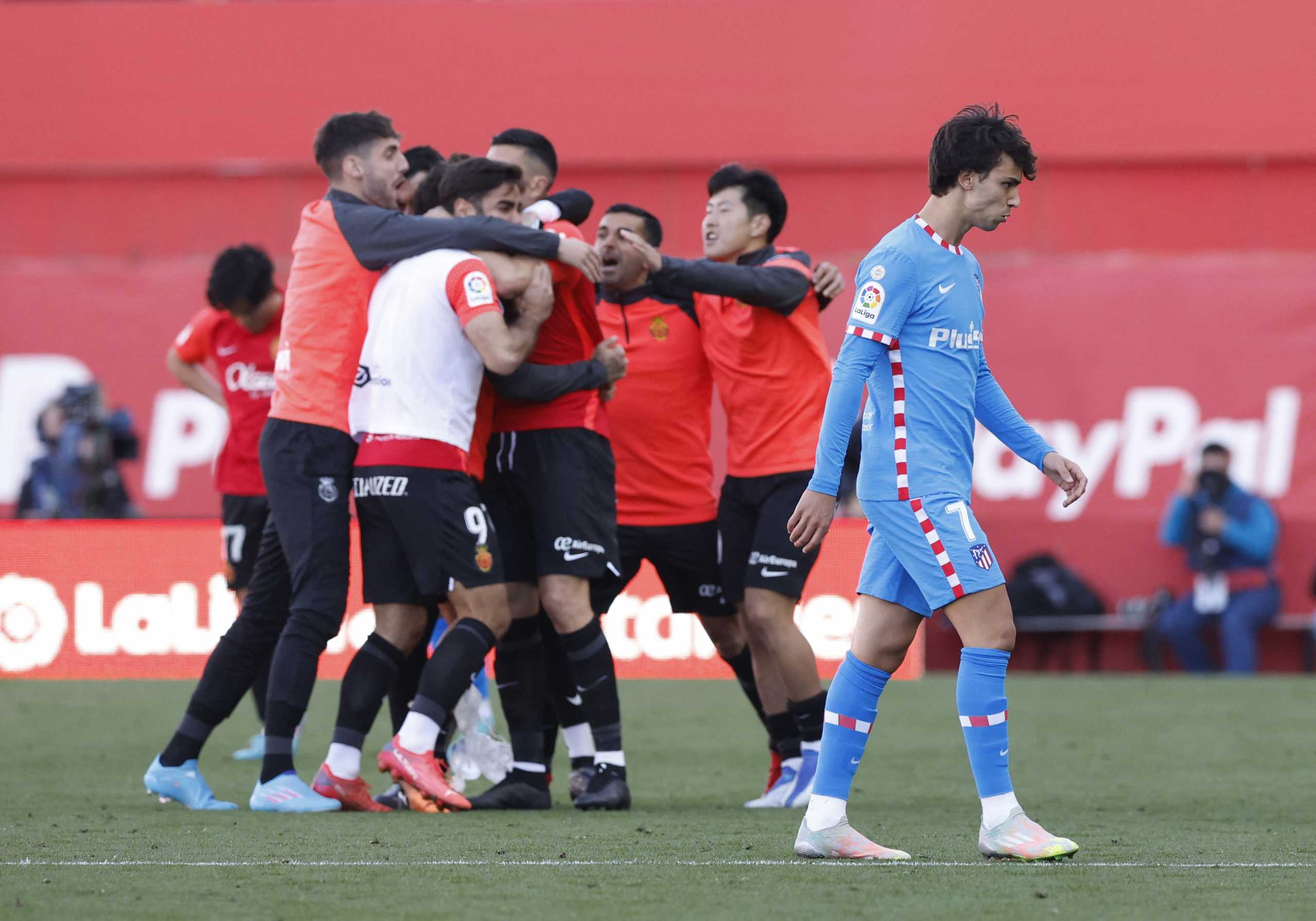 Soccer Football - LaLiga - RCD Mallorca v Atletico Madrid - Visit Mallorca Stadium, Palma, Spain - April 9, 2022 Atletico Madrid's Joao Felix looks dejected as RCD Mallorca players celebrate after the match REUTERS