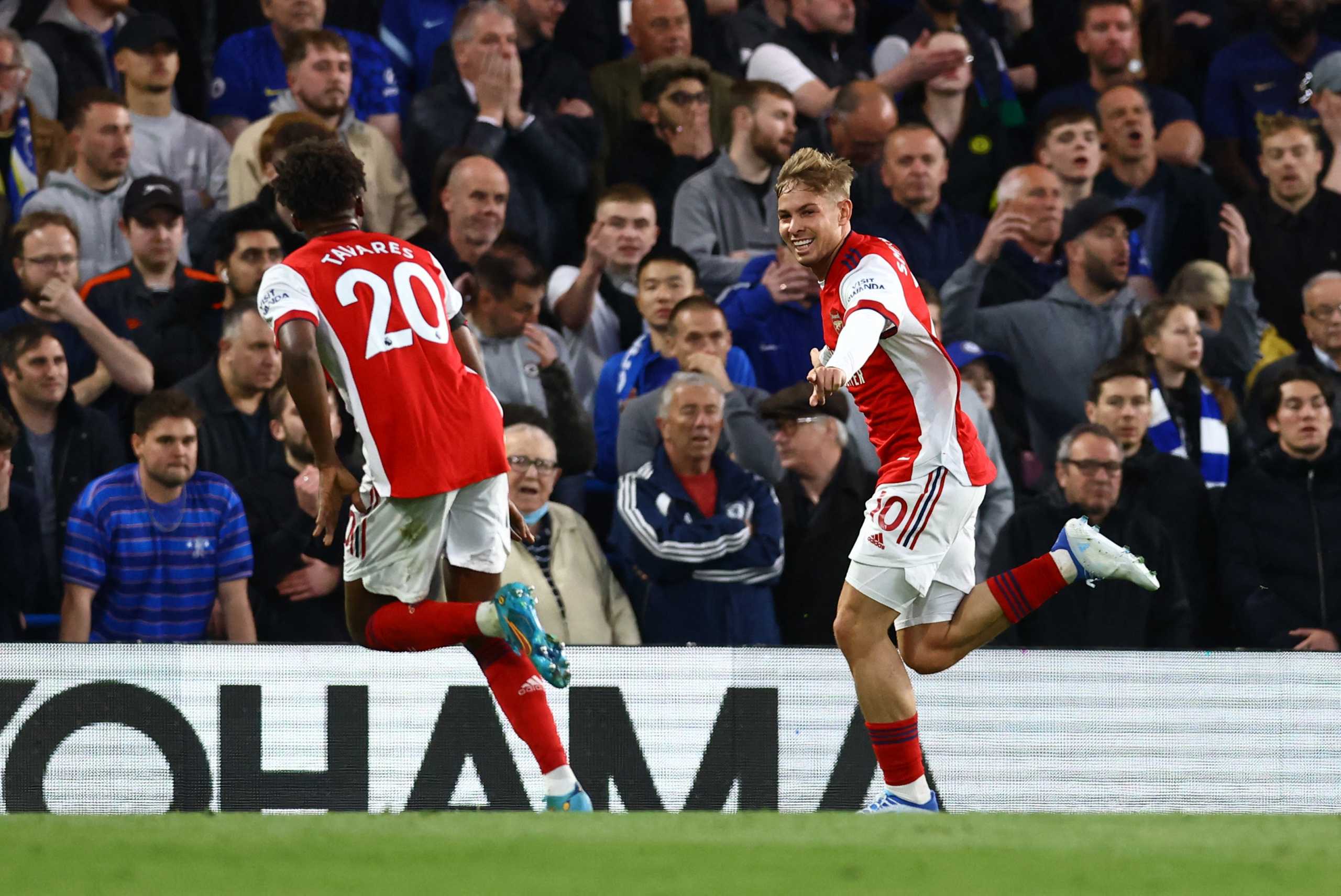 Soccer Football - Premier League - Chelsea v Arsenal - Stamford Bridge, London, Britain - April 20, 2022  Arsenal's Emile Smith Rowe celebrates scoring their second goal with Nuno Tavares REUTERS