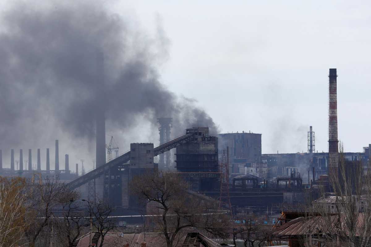Smoke rises above a plant of Azovstal Iron and Steel Works during Ukraine-Russia conflict in the southern port city of Mariupol, Ukraine April 21, 2022. REUTERS