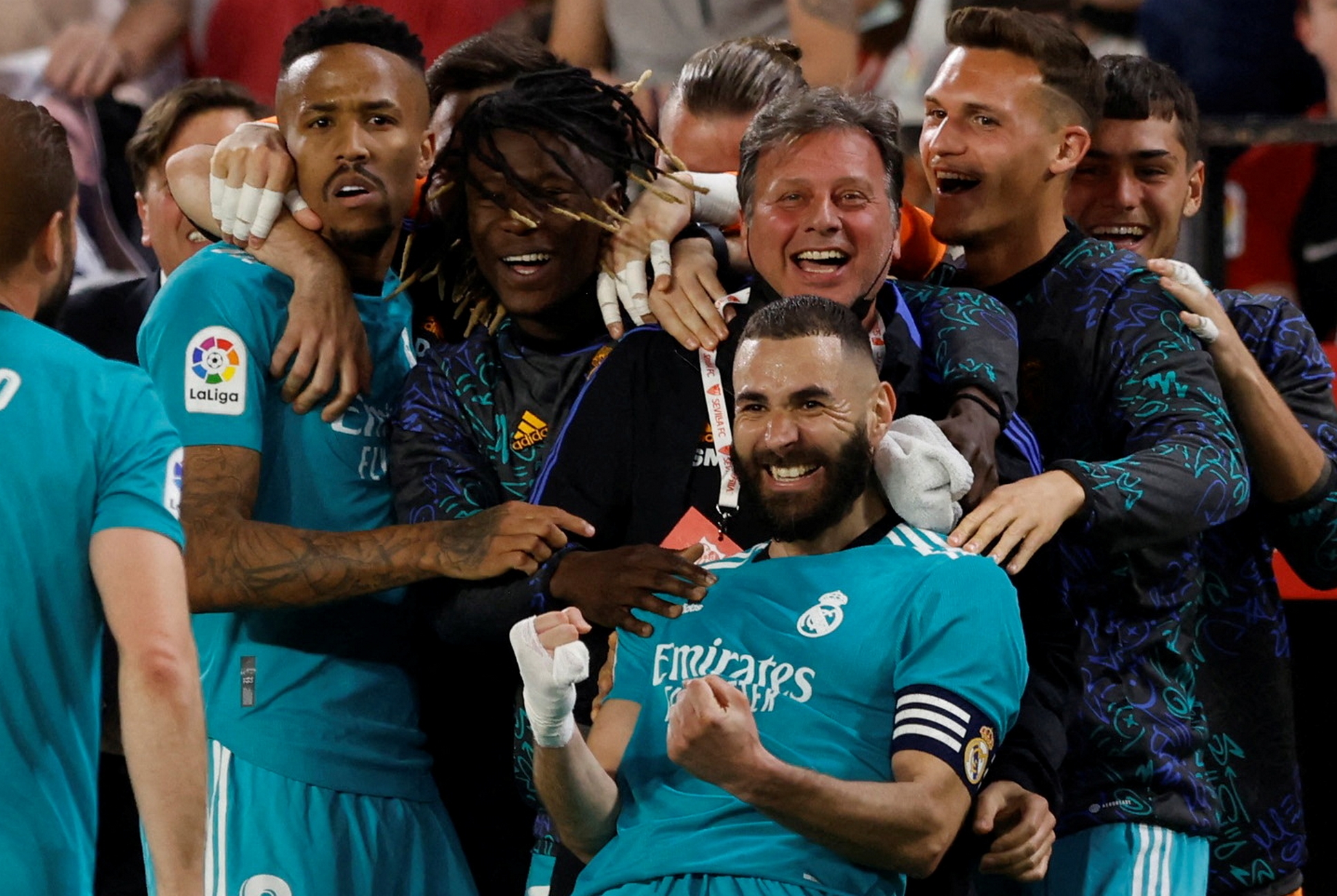 Soccer Football - LaLiga - Sevilla v Real Madrid - Ramon Sanchez Pizjuan, Seville, Spain - April 17, 2022 Real Madrid's Karim Benzema celebrates scoring their third goal with teammates REUTERS