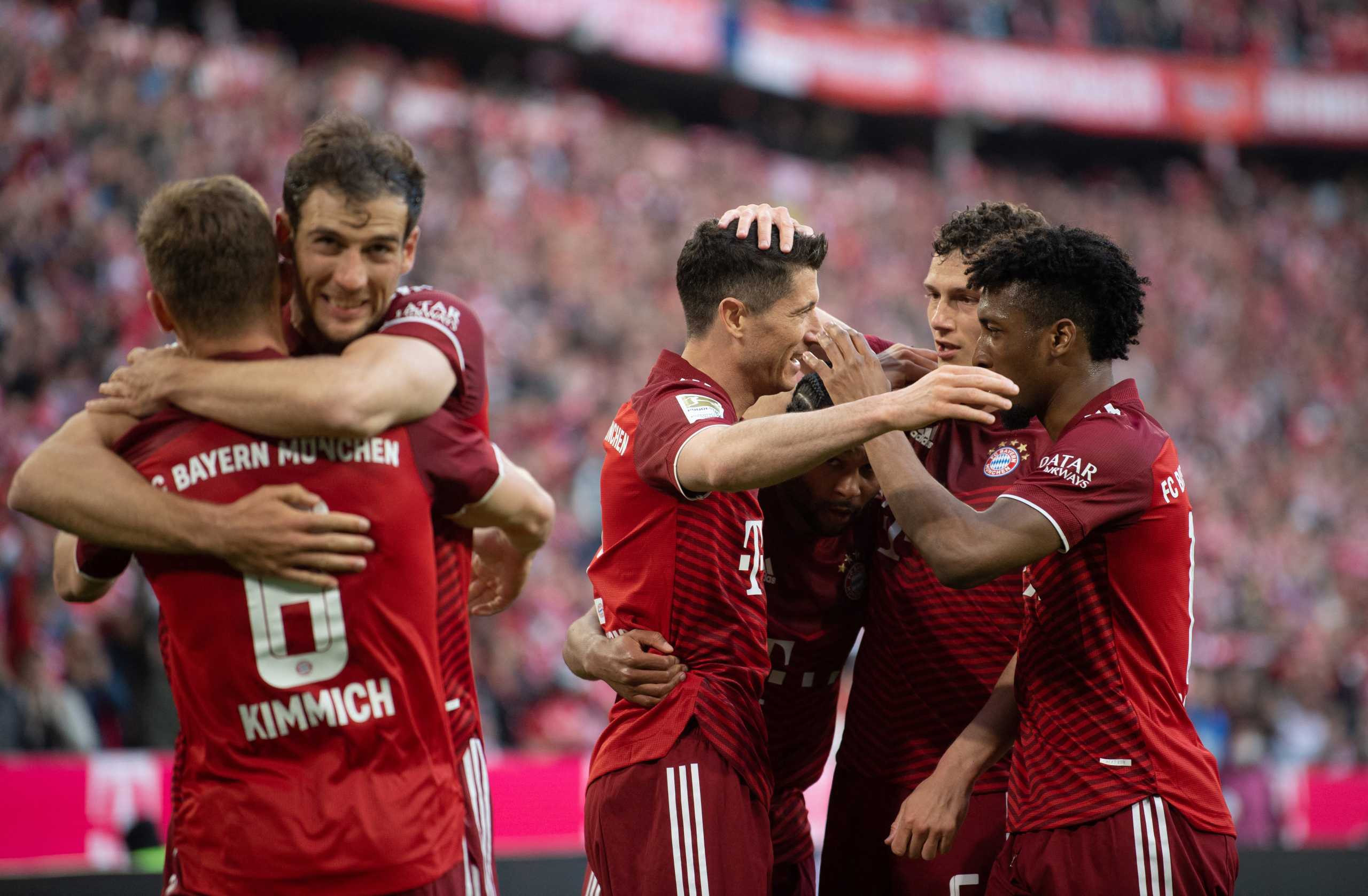 Soccer Football - Bundesliga - Bayern Munich v Borussia Dortmund - Allianz Arena, Munich, Germany - April 23, 2022  Bayern Munich's Robert Lewandowski celebrates scoring their second goal with Kingsley Coman and teammates REUTERS