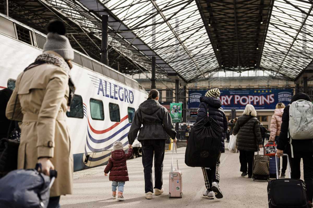Passengers of the second last Allegro train from St Petersburg, Russia, walk at the railway station on Sunday afternoon in Helsinki, Finland March 27, 2022. Allegro train service between Helsinki and St Petersburg will be temporarily discontinued from Monday, March 28, in light of sanctions imposed on Russia after its invasion of Ukraine. Lehtikuva