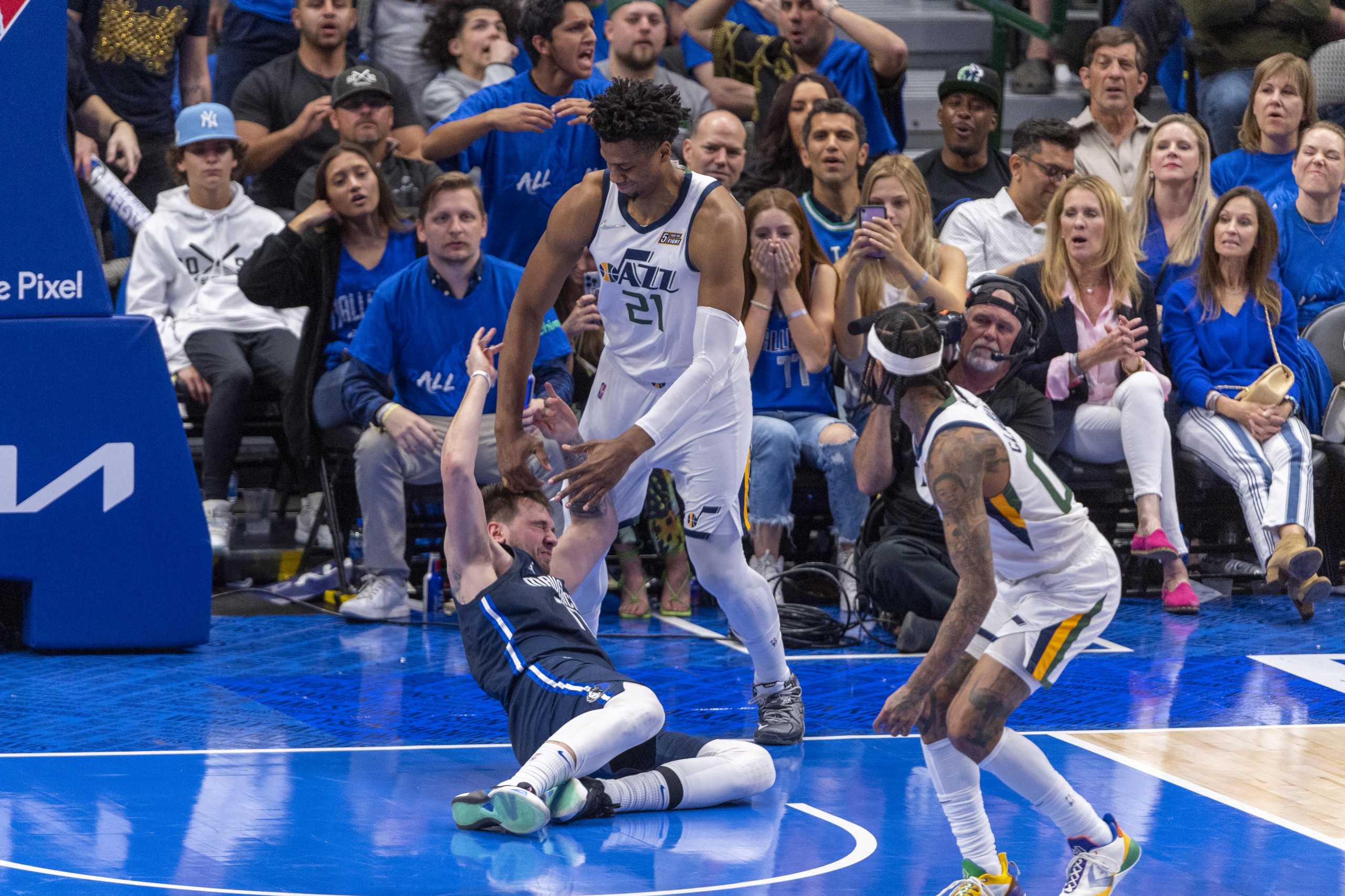 Apr 25, 2022; Dallas, Texas, USA; Dallas Mavericks guard Luka Doncic (77) is fouled by Utah Jazz center Hassan Whiteside (21) during the fourth quarter in game five of the first round for the 2022 NBA playoffs at American Airlines Center. Mandatory Credit: Jerome Miron-USA TODAY Sports
