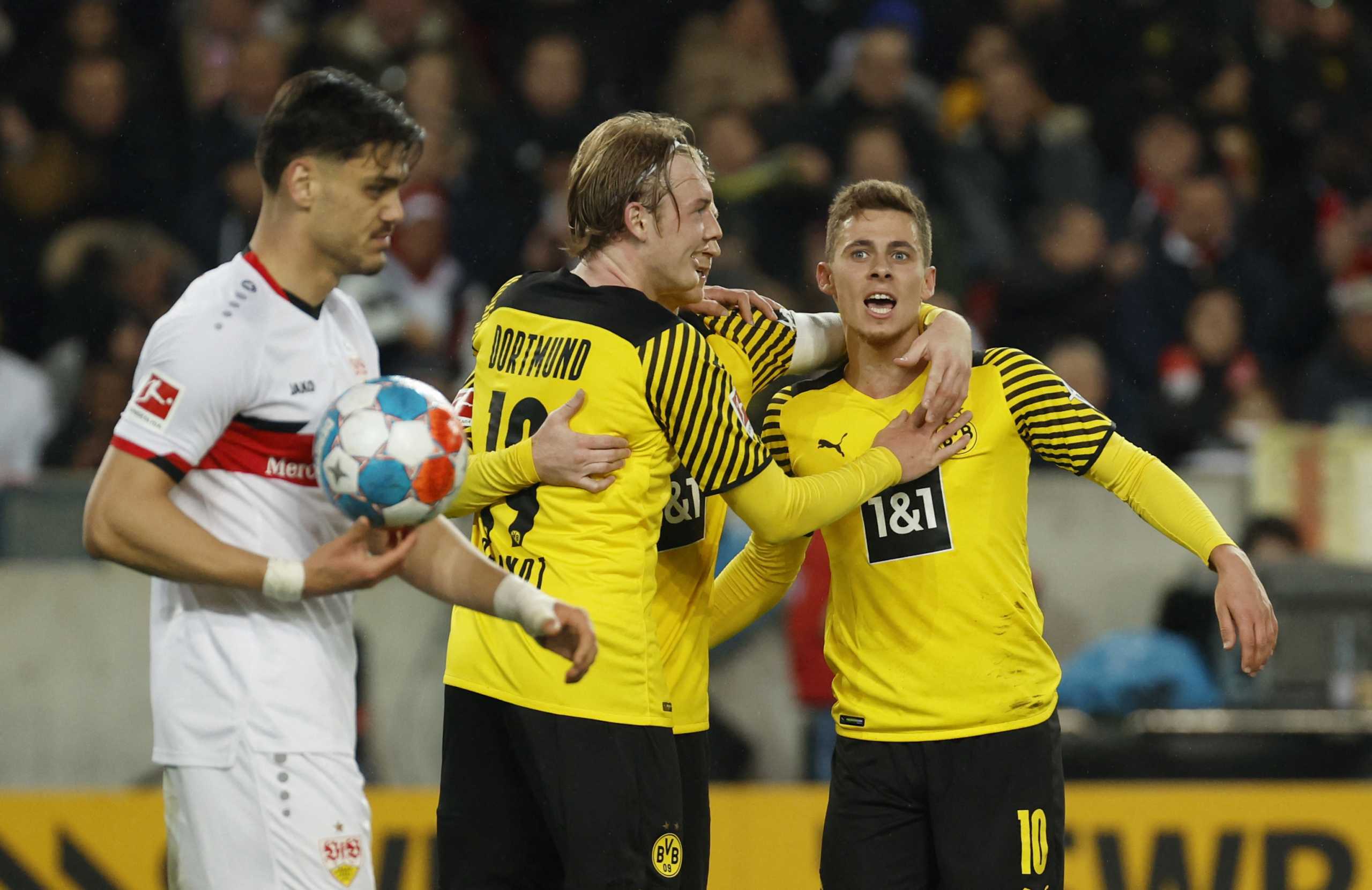 Soccer Football - Bundesliga - VfB Stuttgart v Borussia Dortmund - Mercedes-Benz Arena, Stuttgart, Germany - April 8, 2022  Borussia Dortmund's Julian Brandt celebrates scoring their second goal with Thorgan Hazard REUTERS