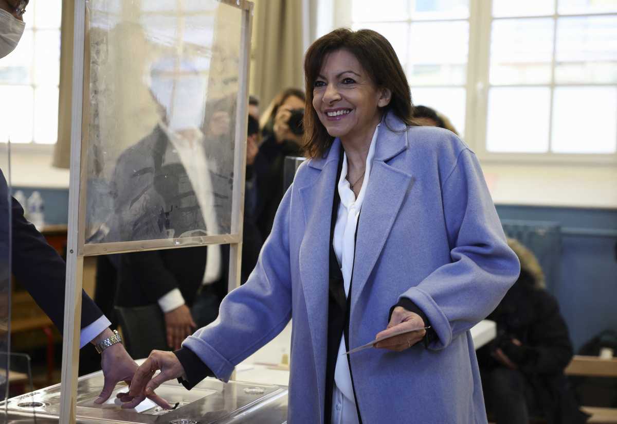 Anne Hidalgo, mayor of Paris and Socialist Party (PS) presidential candidate, casts her ballot to vote in the first round of the 2022 French presidential election at a polling station in Paris, France, April 10, 2022. REUTERS