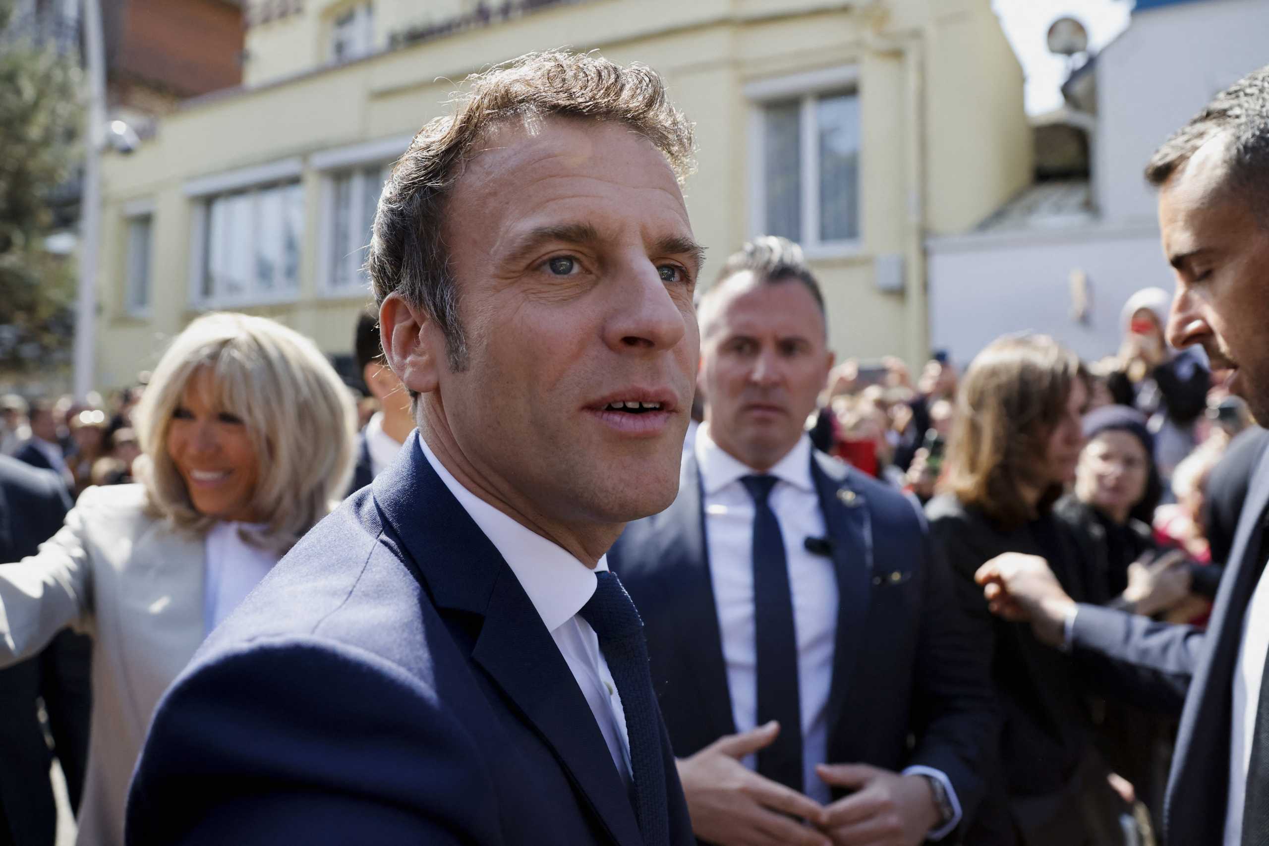 French President Emmanuel Macron, candidate for his re-election, leaves his home to vote in the second round of the 2022 French presidential election, in Le Touquet-Paris-Plage, France, April 24, 2022. REUTERS
