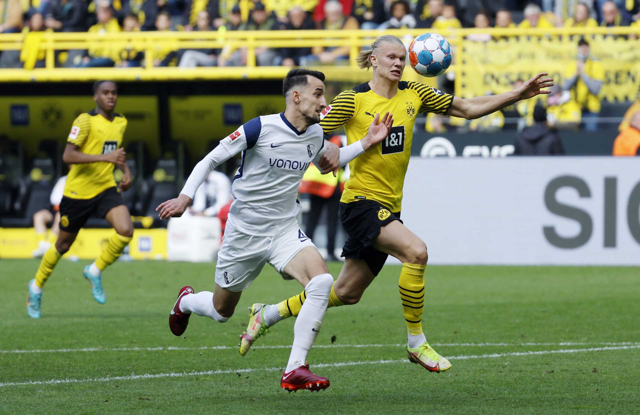 Soccer Football - Bundesliga - Borussia Dortmund v VfL Bochum - Signal Iduna Park, Dortmund, Germany - April 30, 2022 VfL Bochum's Erhan Masovic in action with Borussia Dortmund's Erling Braut Haaland REUTERS