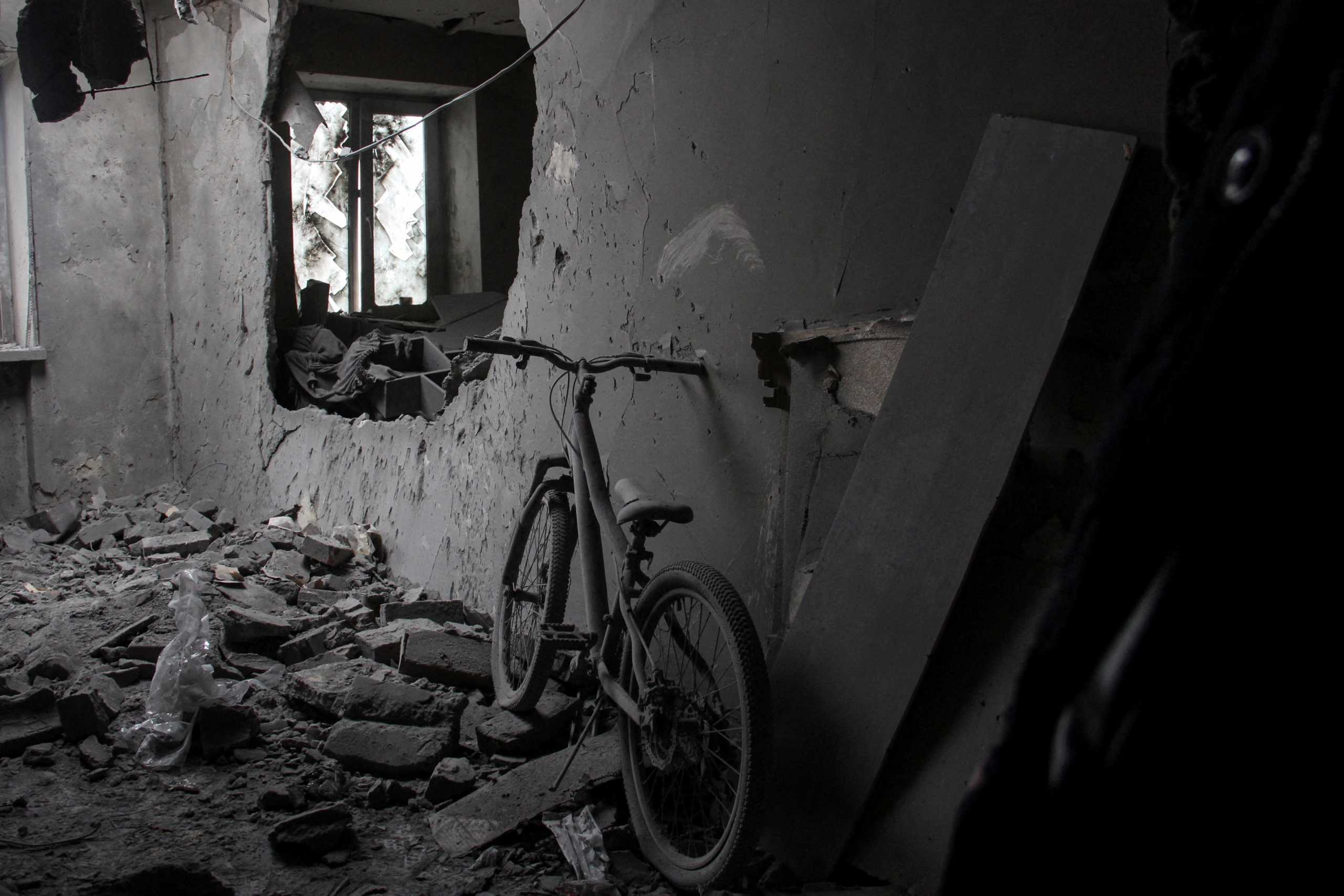A bicycle is seen inside a heavily damaged room, following Russian shelling, amid Russia's invasion of Ukraine, in Kharkiv, Ukraine, April 20, 2022. REUTERS