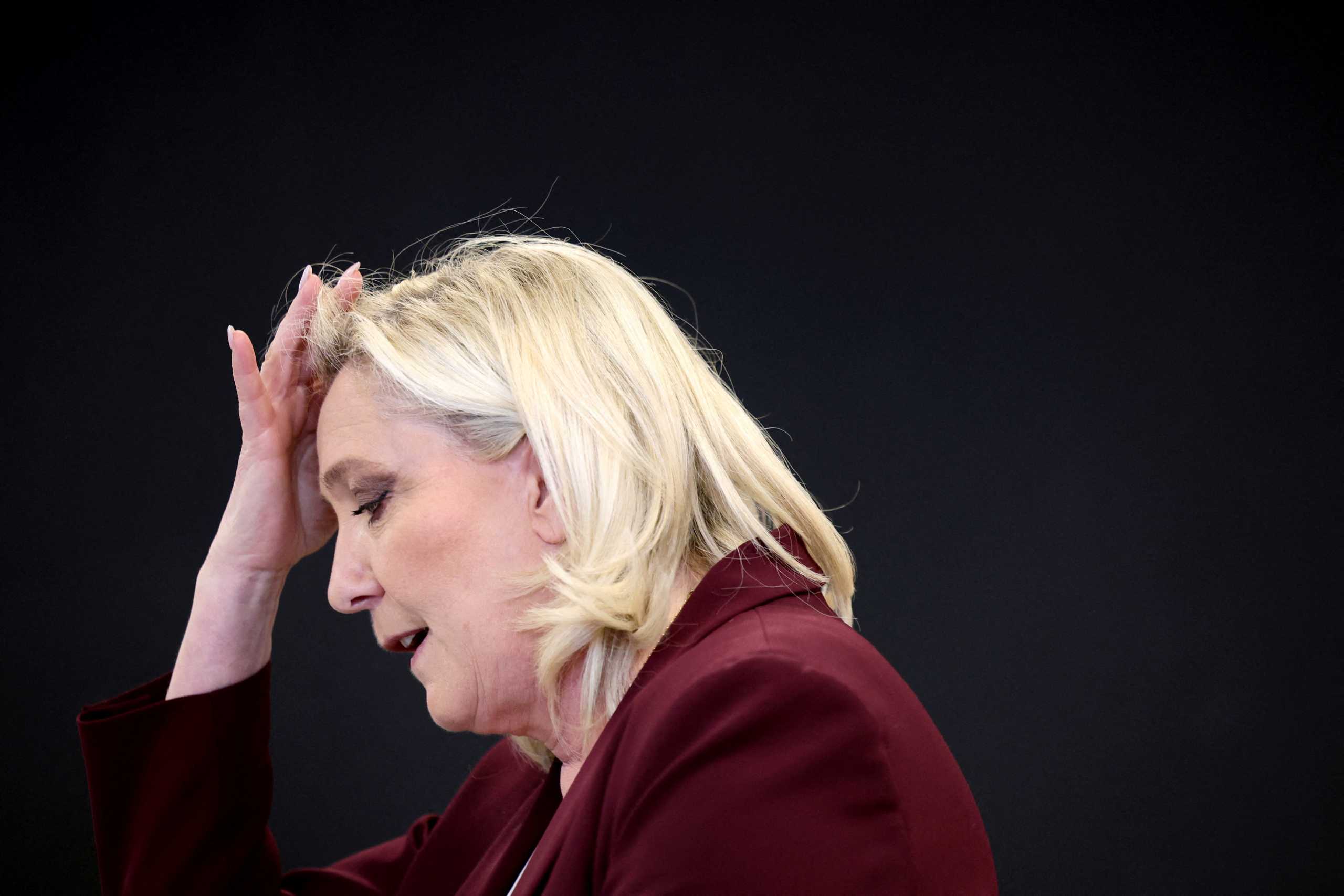 Marine Le Pen, French far-right National Rally (Rassemblement National) party candidate for the 2022 French presidential election, gestures as she speaks during a news conference in Vernon, France, April 12, 2022. REUTERS