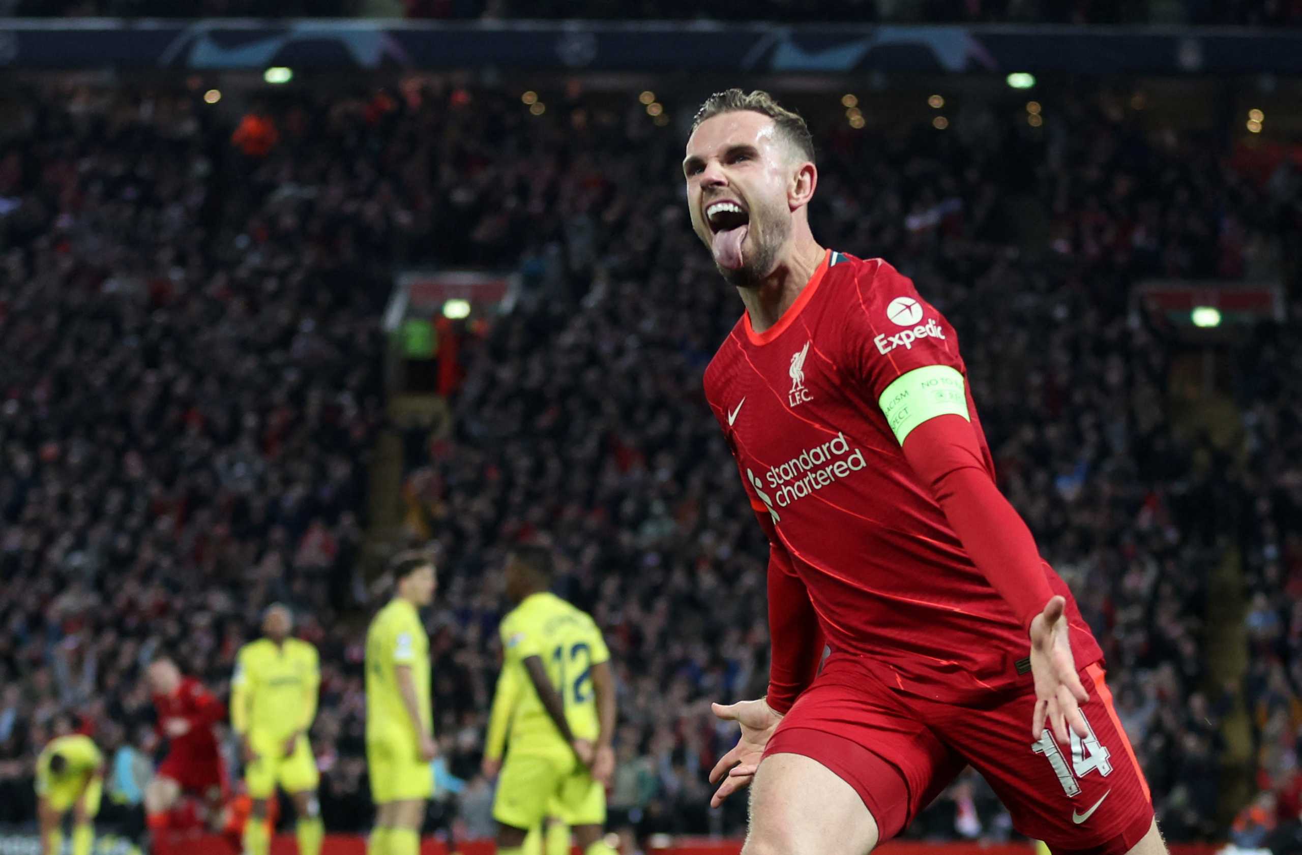 Soccer Football - Champions League - Semi Final - First Leg - Liverpool v Villarreal - Anfield, Liverpool, Britain - April 27, 2022 Liverpool's Jordan Henderson celebrates after Villarreal's Pervis Estupinan scored Liverpool's first with an own goal after deflecting a shot by Henderson Action Images via Reuters