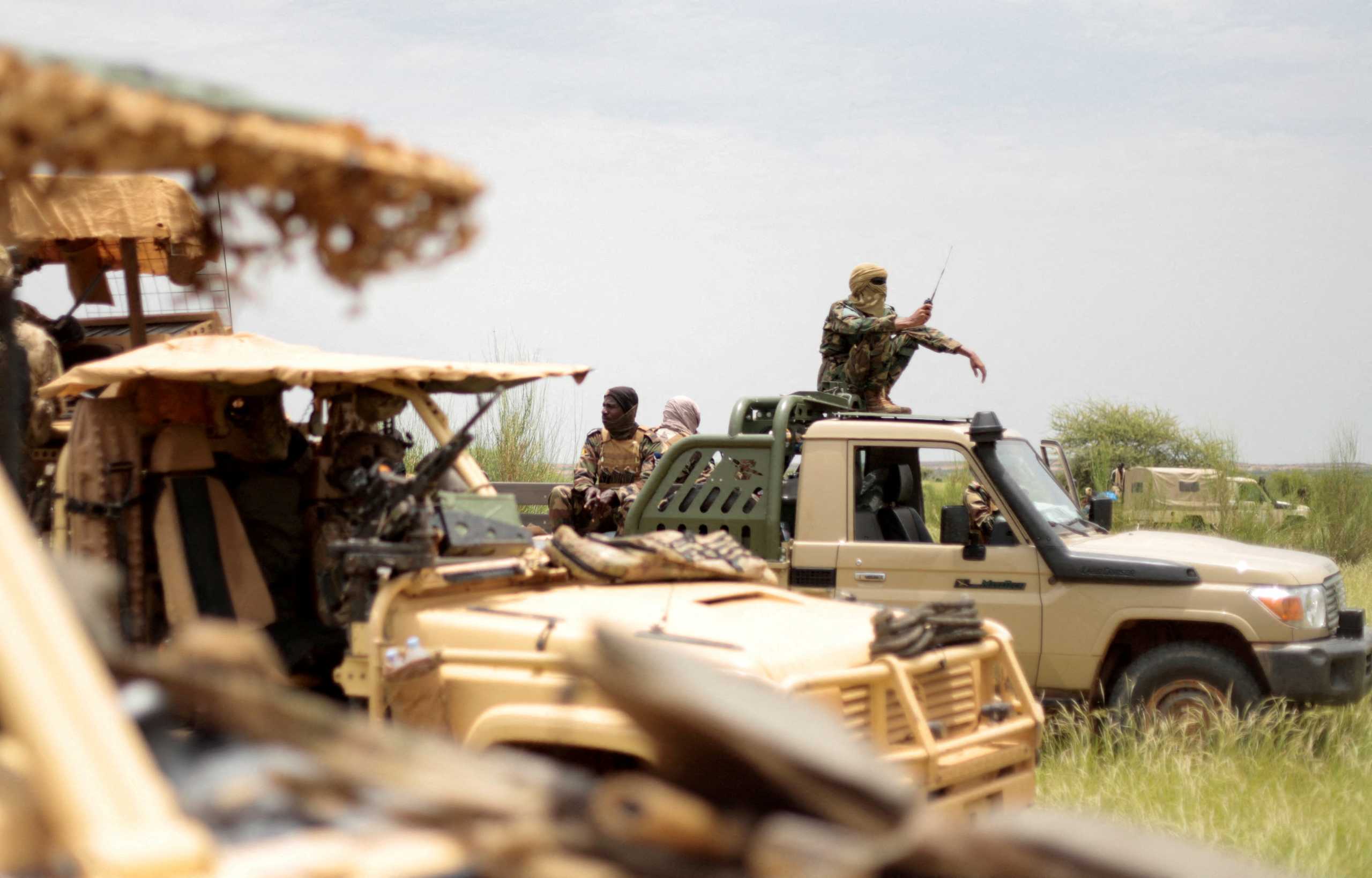 FILE PHOTO: Malian soldiers are pictured during a patrol with soldiers from the new Takuba force near Niger border in Dansongo Circle, Mali August 23, 2021. Picture taken August 23, 2021. REUTERS