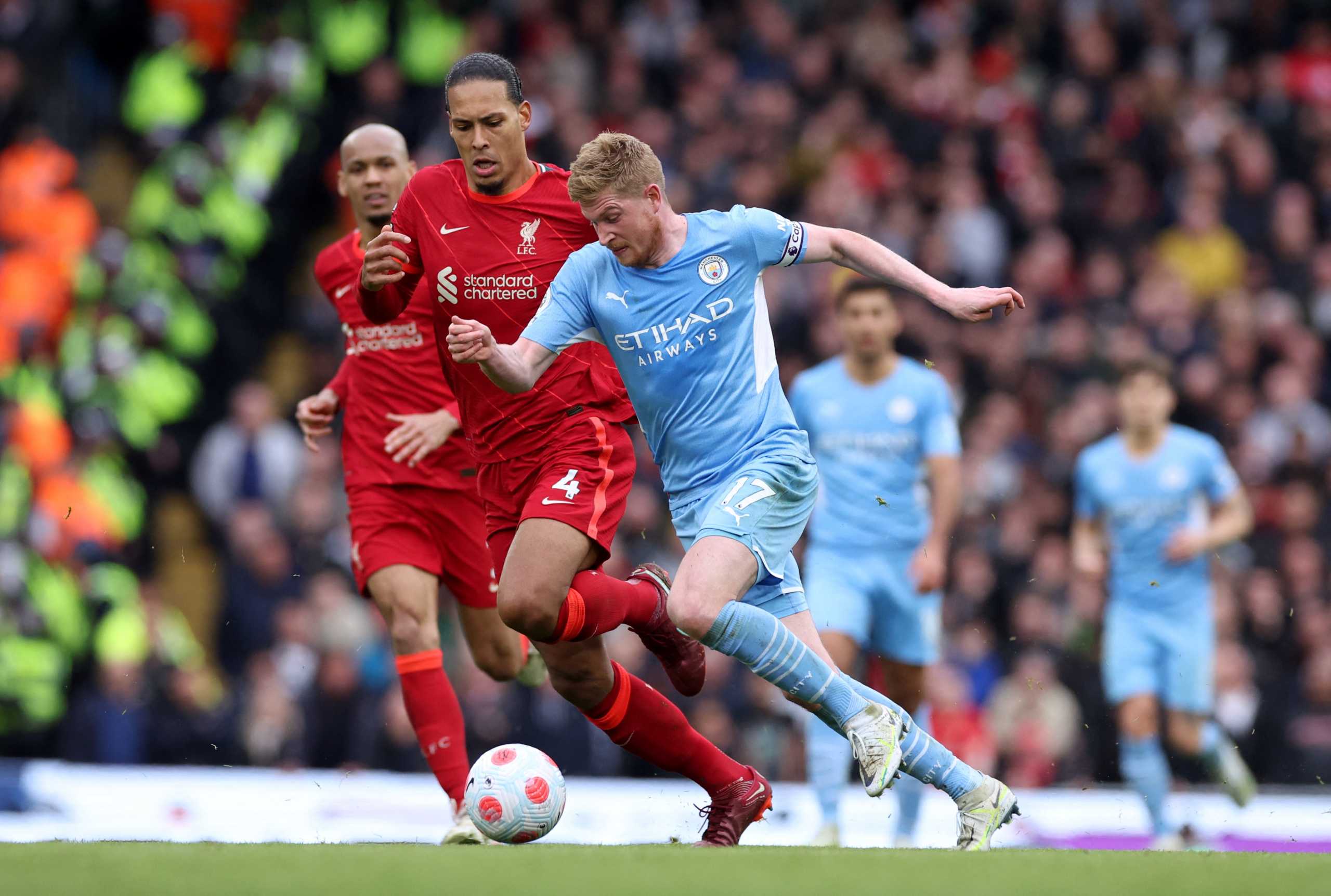 Soccer Football - Premier League - Manchester City v Liverpool - Etihad Stadium, Manchester, Britain - April 10, 2022 Liverpool's Virgil van Dijk in action with Manchester City's Kevin De Bruyne REUTERS