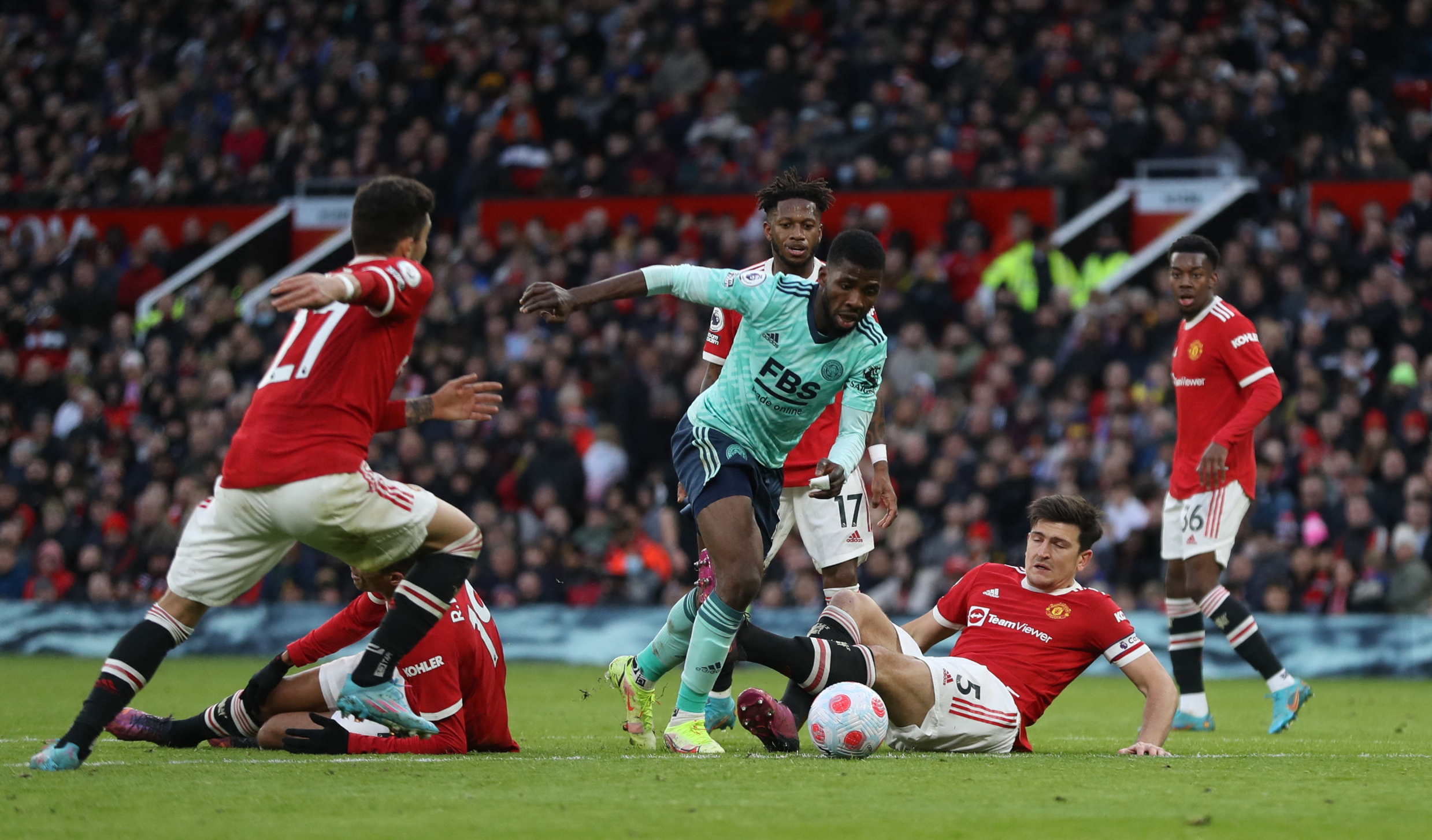 Soccer Football - Premier League - Manchester United v Leicester City - Old Trafford, Manchester, Britain - April 2, 2022 Leicester City's Kelechi Iheanacho in action with Manchester United's Harry Maguire REUTERS