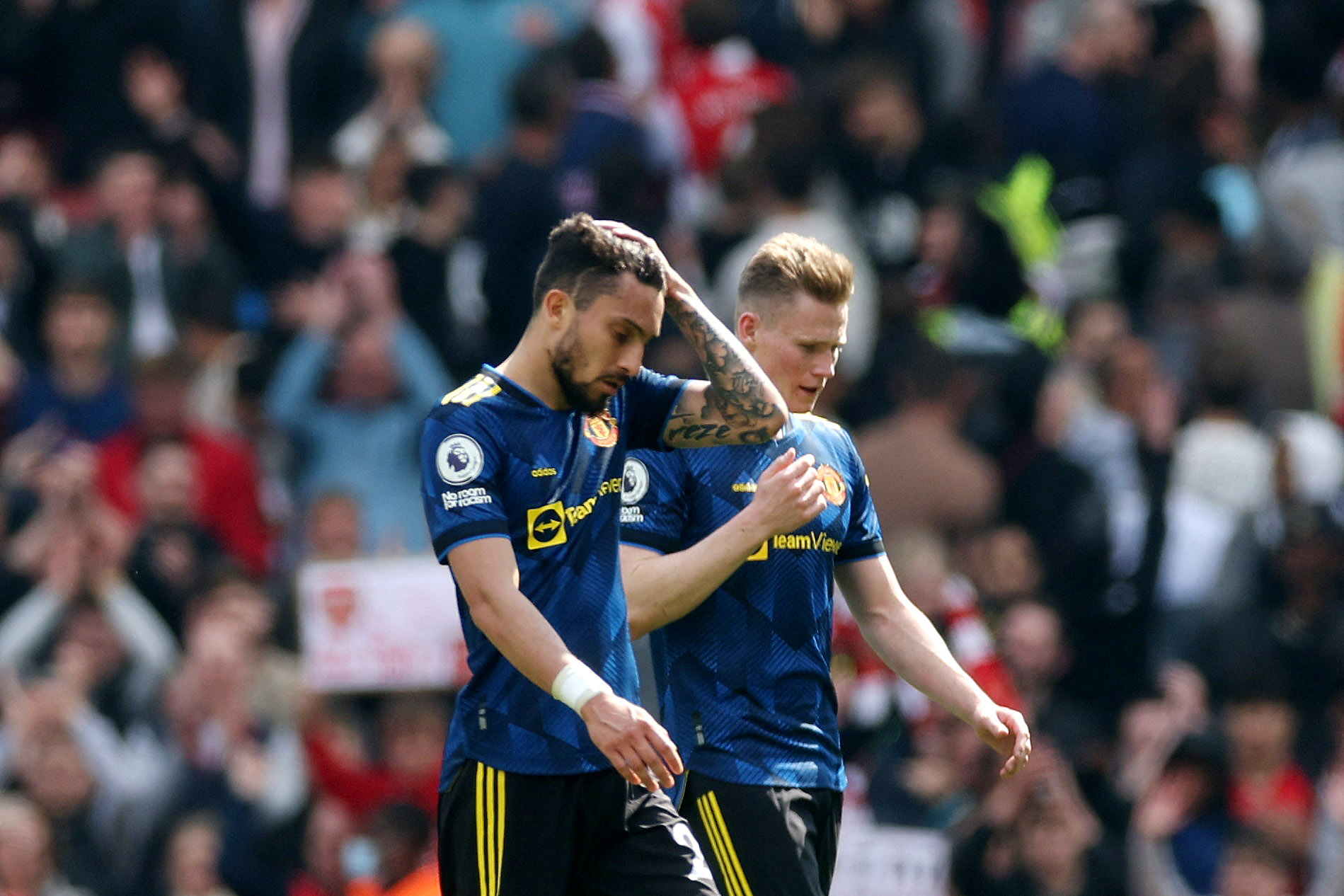Soccer Football - Premier League - Arsenal v Manchester United - Emirates Stadium, London, Britain - April 23, 2022 Manchester United's Alex Telles and Scott McTominay look dejected after the match Action Images via Reuters