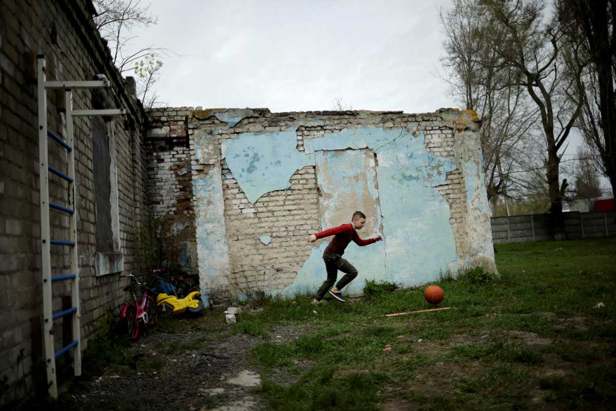 A Ukrainian boy plays at the "Mariupol House of Mothers and Children" shelter, amid Russia's invasion of Ukraine, in the town of Novomoskovsk, Dnipro region, Ukraine April 23, 2022. REUTERS