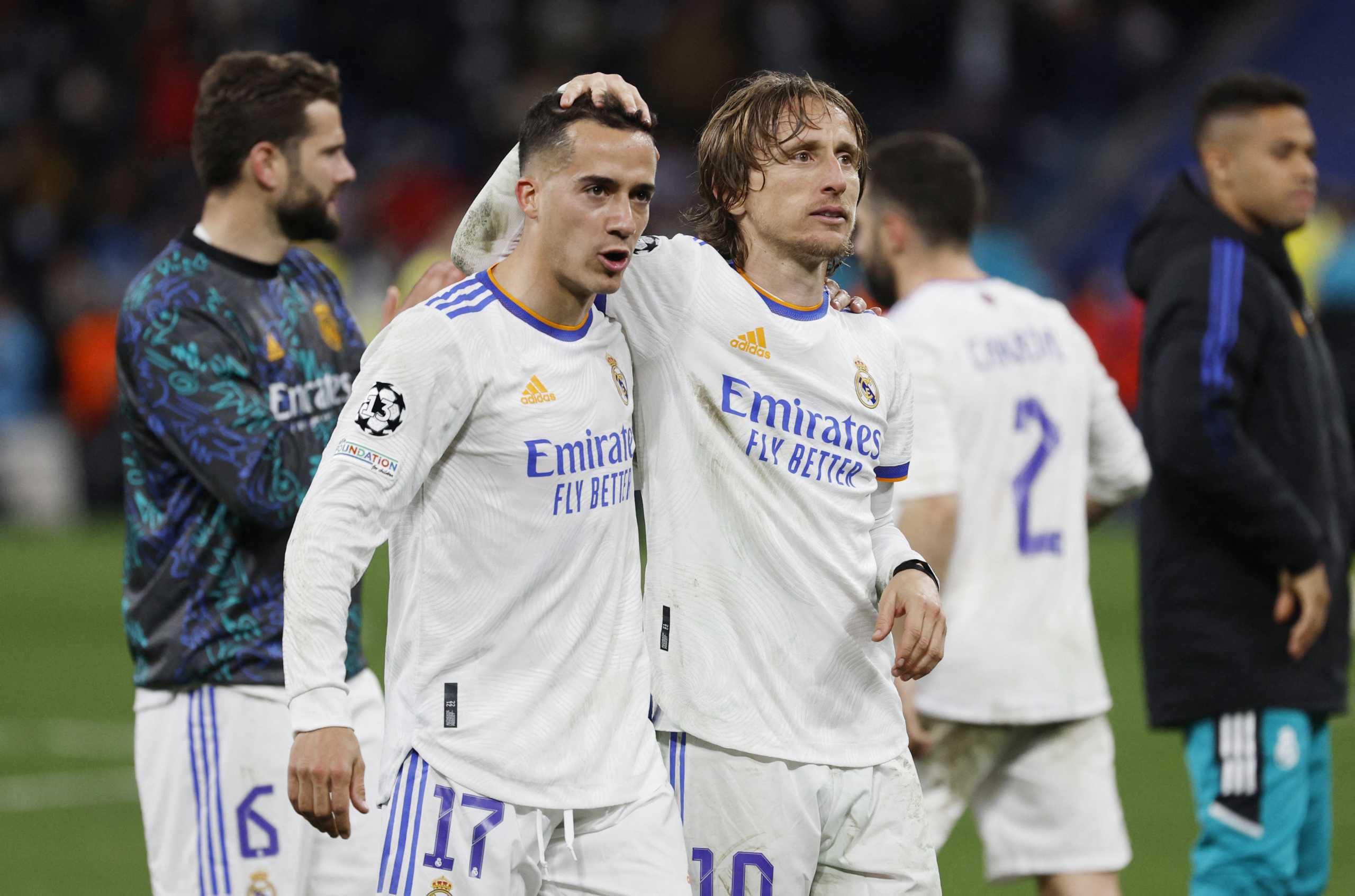 Soccer Football - Champions League - Quarter Final - Second Leg - Real Madrid v Chelsea - Santiago Bernabeu, Madrid, Spain - April 12, 2022 Real Madrid's Lucas Vazquez and Luka Modric celebrate after the match REUTERS