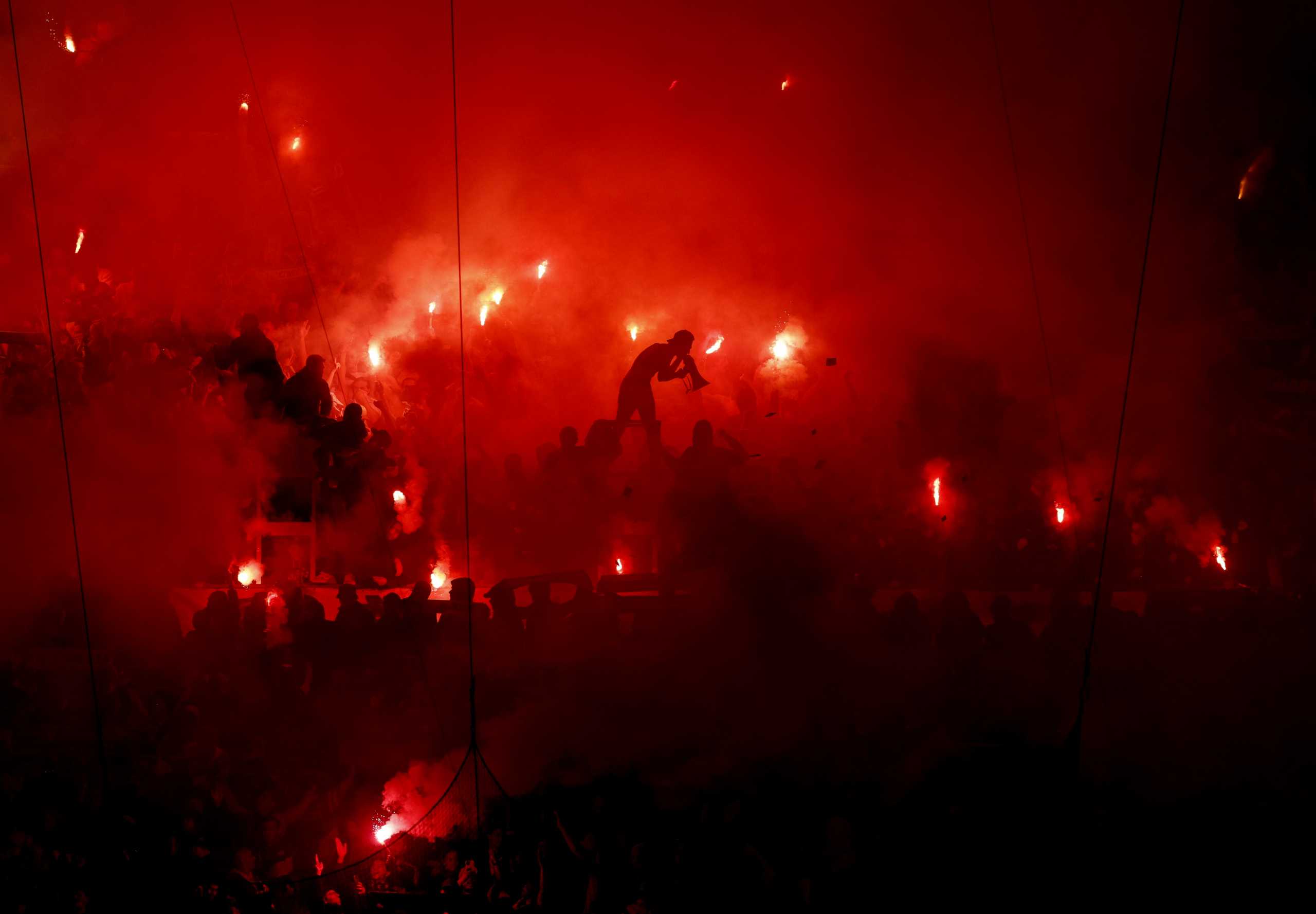 Soccer Football - Europa Conference League - Quarter Final - First Leg - Olympique Marseille v PAOK - Orange Velodrome, Marseille, France - April 7, 2022 Fans with flares are pictured inside the stadium before the match REUTERS
