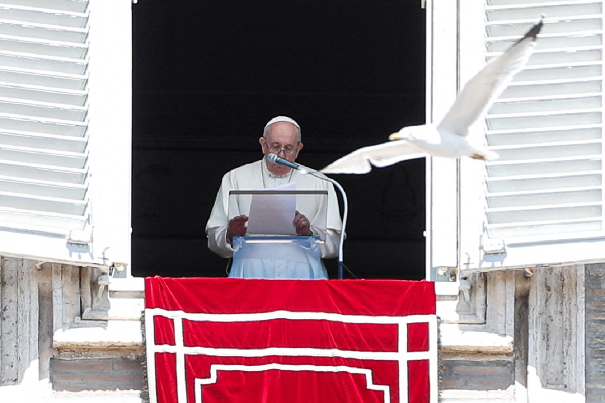 A seagull flies next to Pope Francis as he speaks during Regina Caeli prayer, in Saint Peter's square at the Vatican, April 24, 2022. REUTERS