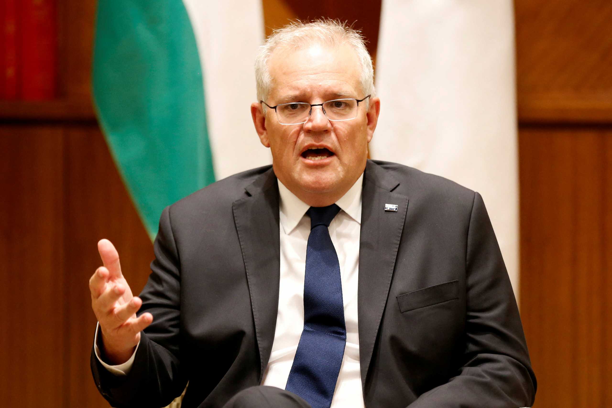 FILE PHOTO: Australian Prime Minister Scott Morrison speaks to the media at Melbourne Commonwealth Parliament Office, in Melbourne, Australia February 11, 2022. Darrian Traynor