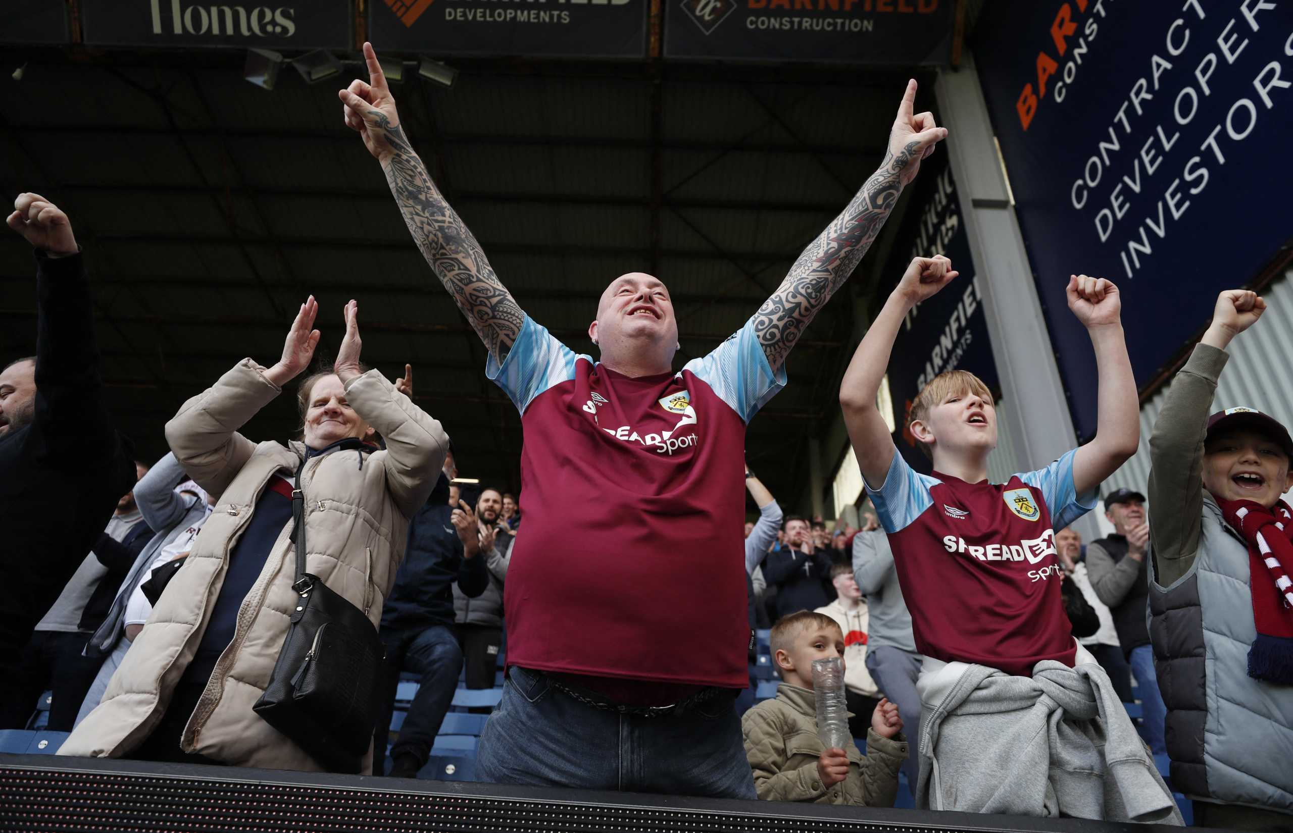 Soccer Football - Premier League - Burnley v Wolverhampton Wanderers - Turf Moor, Burnley, Britain - April 24, 2022 Burnley fans celebrate after the match Action Images via Reuters