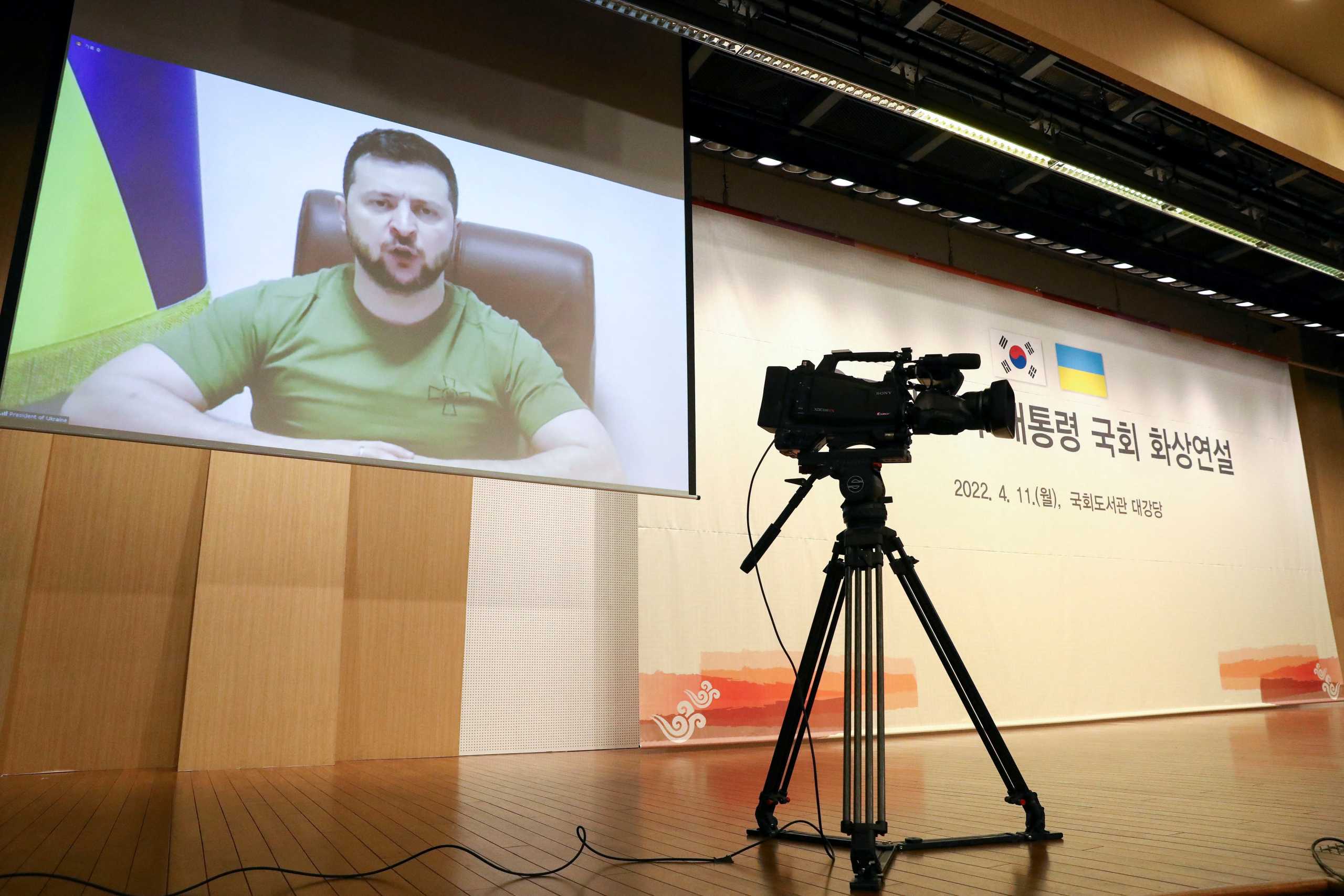 Ukrainian President Volodymyr Zelenskiy addresses South Korean parliament via video link at National Assembly in Seoul, South Korea April 11, 2022. Chung Sung-Jun