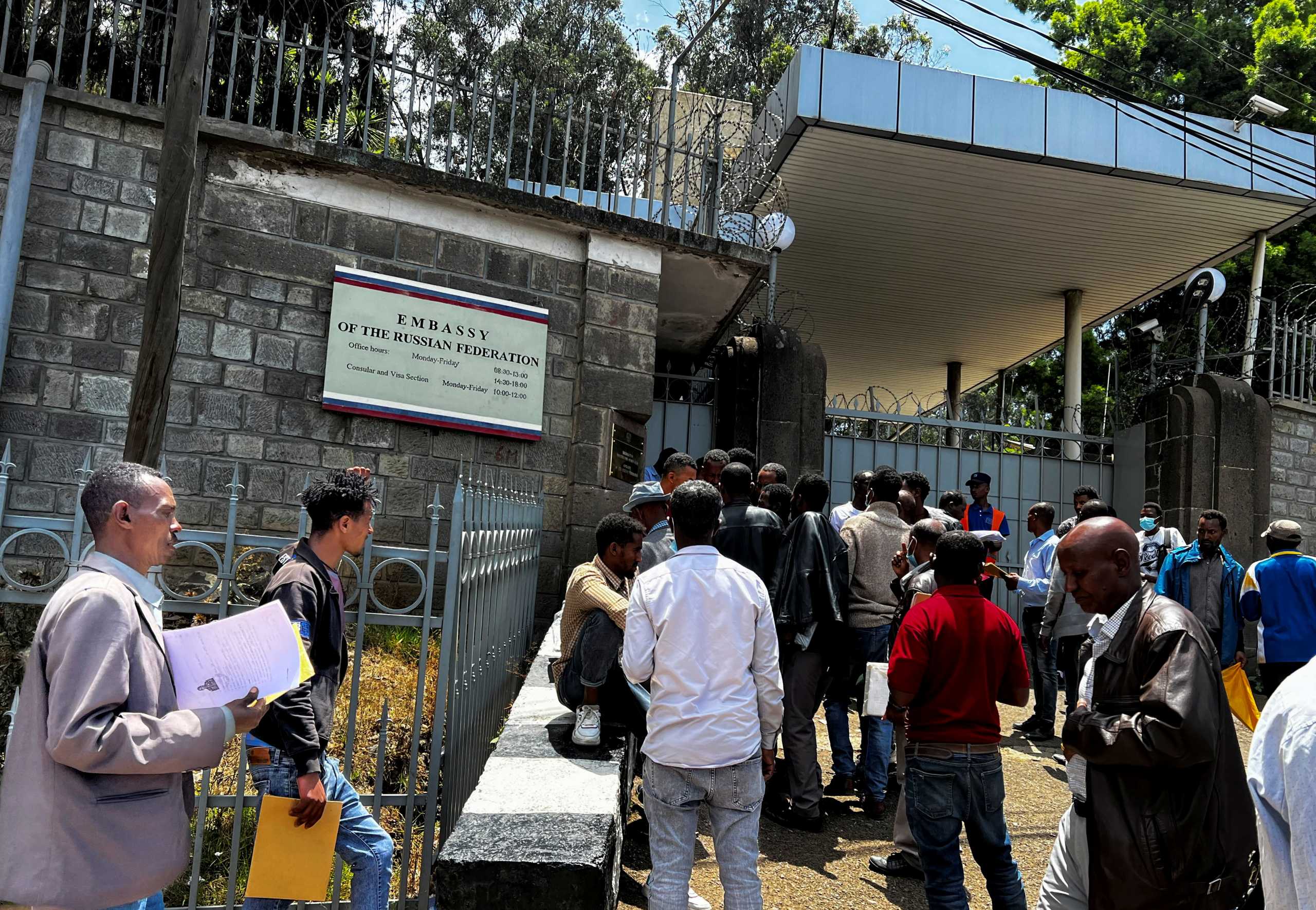 Ethiopian men, drawn by rumours on social media, queue to register to join Russian forces fighting in Ukraine, outside the Russian embassy in Addis Ababa, Ethiopia April 19, 2022. Picture taken April 19, 2022. REUTERS
