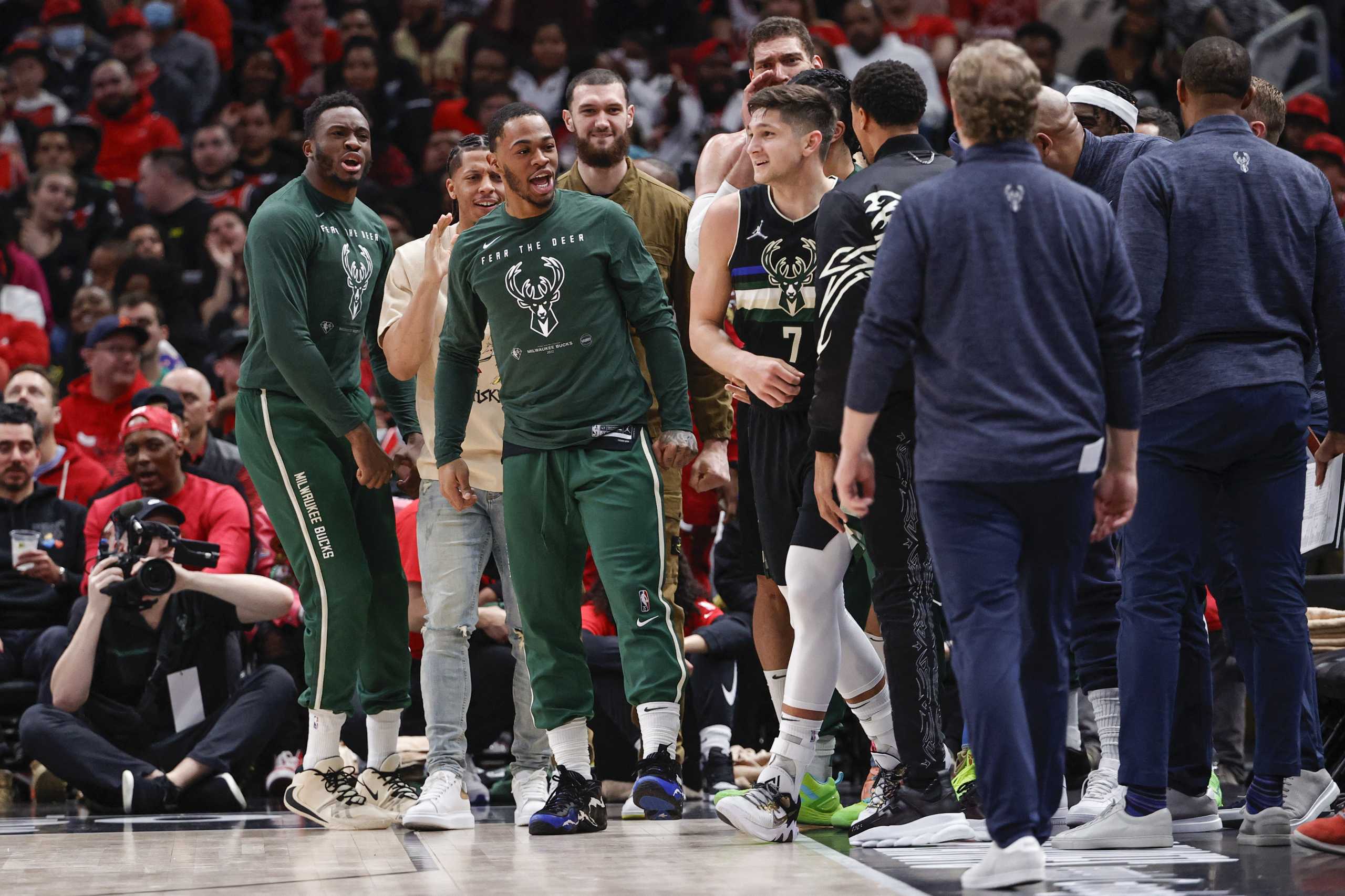 Apr 22, 2022; Chicago, Illinois, USA; Milwaukee Bucks guard Grayson Allen (7) celebrates with teammates after scoring against the Chicago Bulls during the second half of game three of the first round for the 2022 NBA playoffs at United Center. Mandatory Credit: Kamil Krzaczynski-USA TODAY Sports